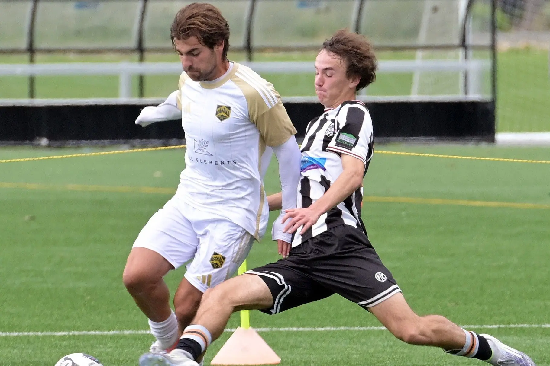 Northern\\'s Isaac Simons (right) and W\\u0101naka\\'s Robert Mackay battle for their ball during their Southern League football game at Logan Park this season. Photo: Gerard O\\'Brien