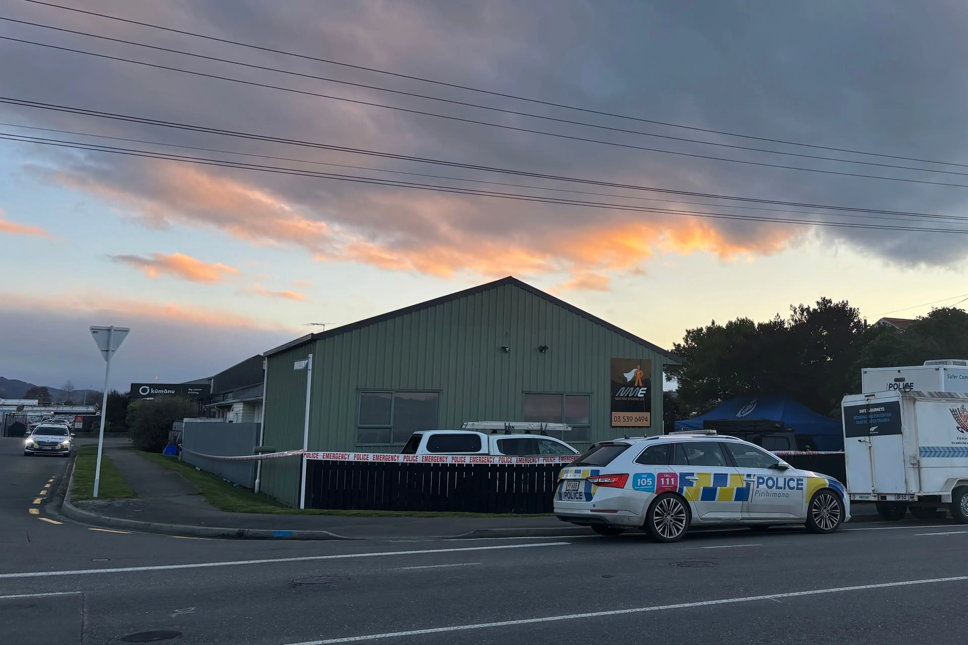 Police outside a property in Tahunanui, Nelson, on Friday. Photo: RNZ