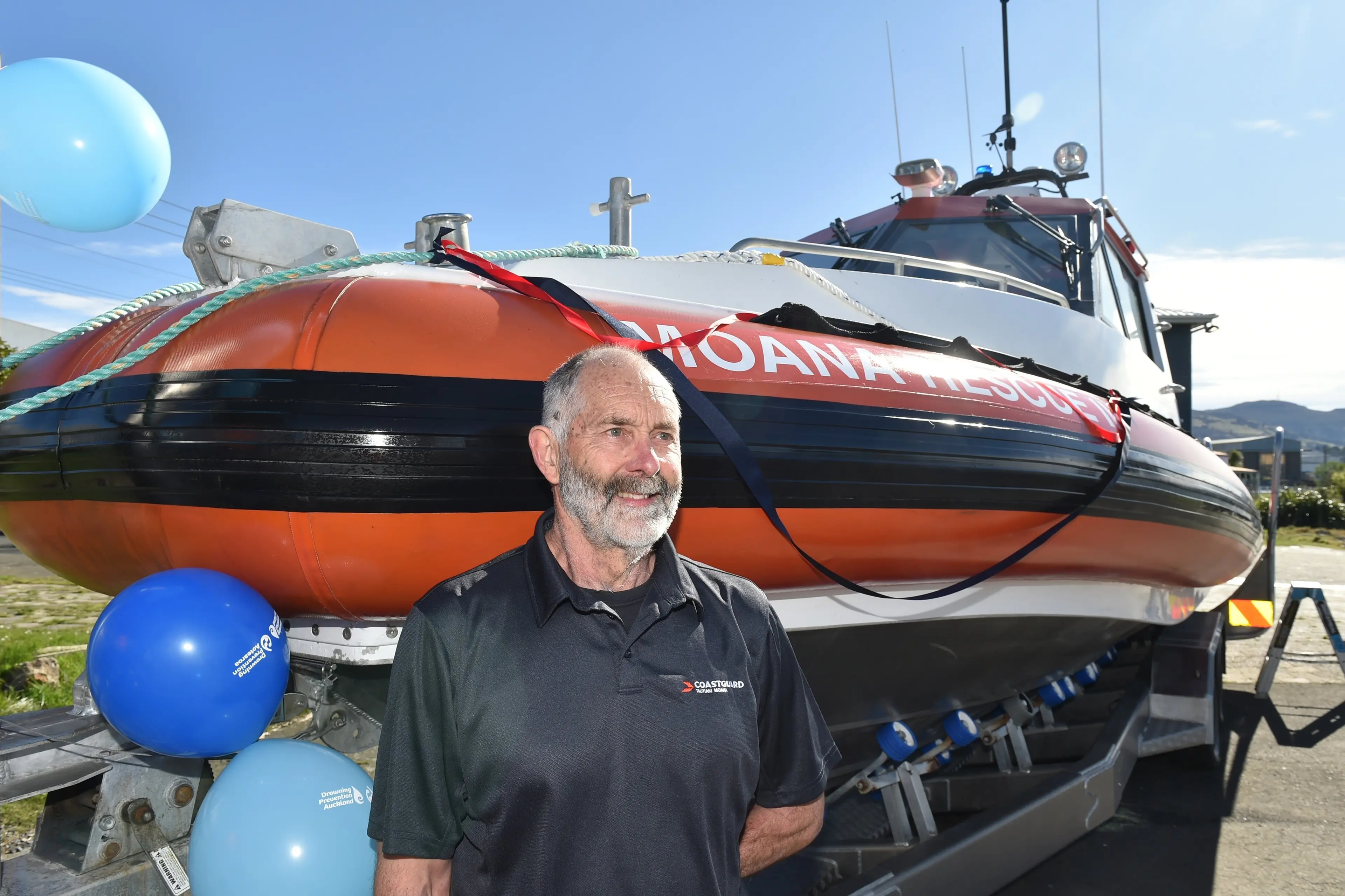 Coastguard Dunedin president Mac McDonald stands beside <i>Moana Rescue II</i> at the  volunteer maritime \\nsearch and rescue organisation\\u2019s operations base in Kitchener St, Dunedin on Saturday. Photo: Gregor Richardson