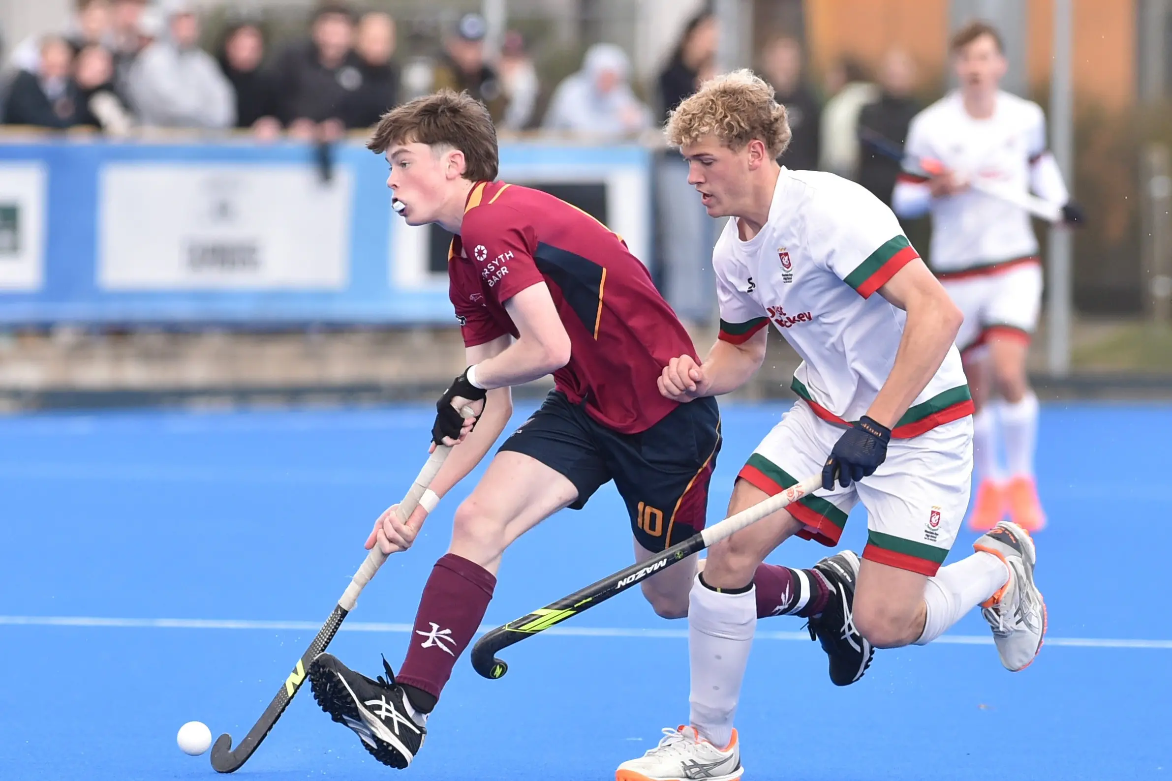 King\\'s College attacker Tarquin Johnson (left) shifts the ball upfield in front of Westlake Boys\\' defender Caleb Maunder during the Rankin Cup final at the McMillan Centre on Saturday. Photo: Gregor Richardson