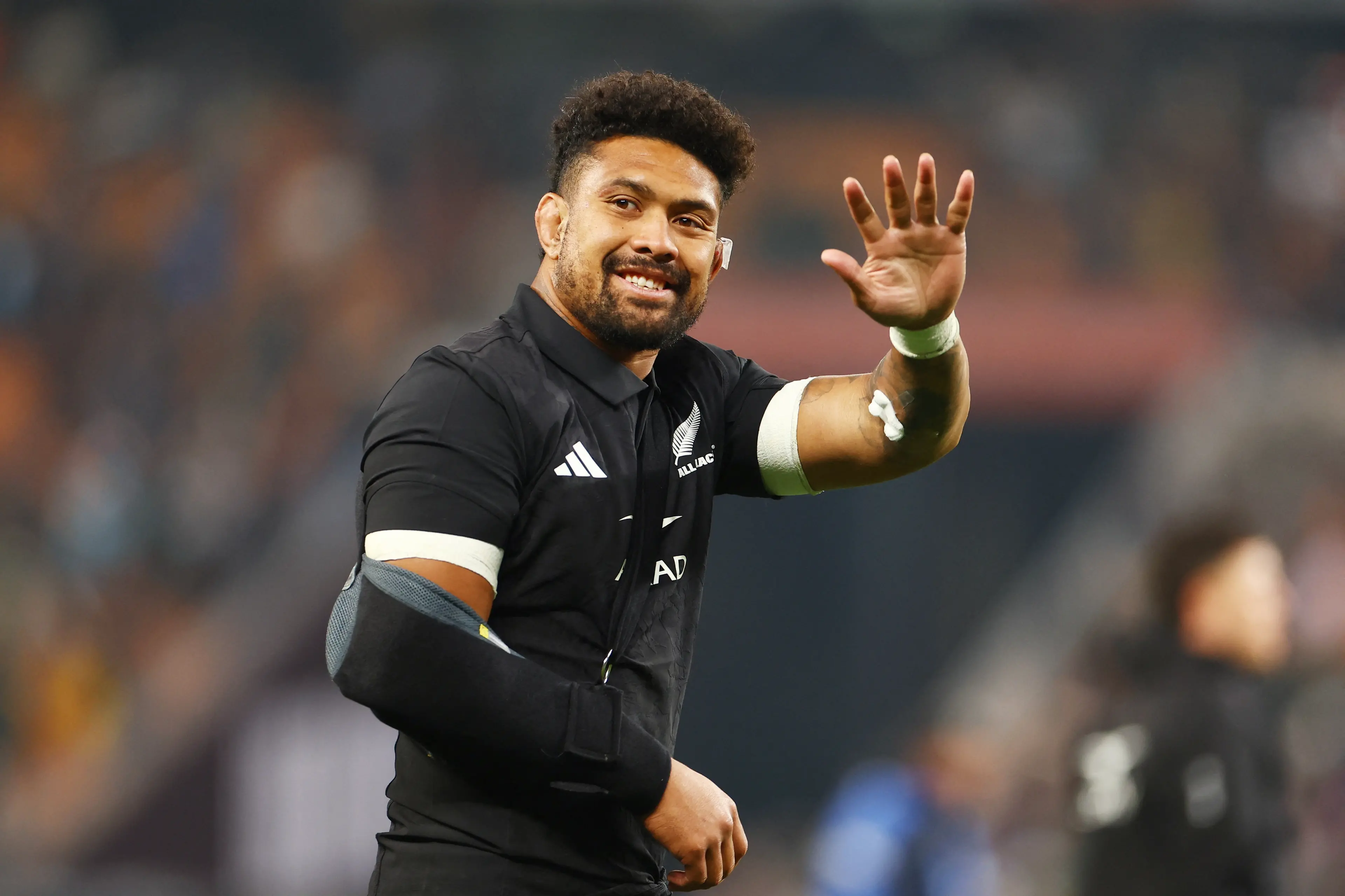 Injured All Blacks captain Ardie Savea waves to fans after the match. Photo: Reuters