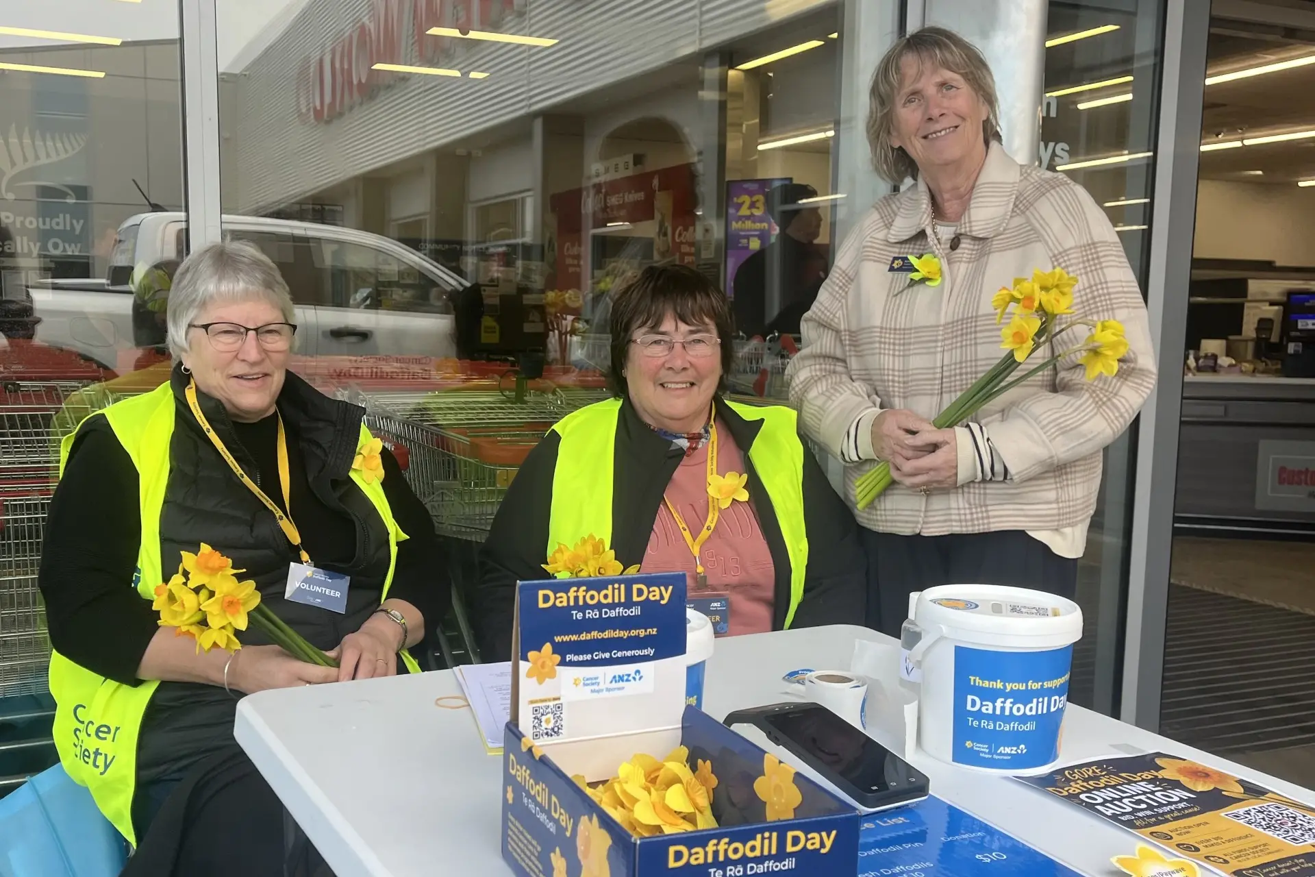 Daffodil Day volunteers (from left) Diane Broom, Karen Heslip and Cancer Society navigator Aynsley Dermody help collect donations from outside New World in Gore on Daffodil Day. Photo: Gerrit Doppenberg