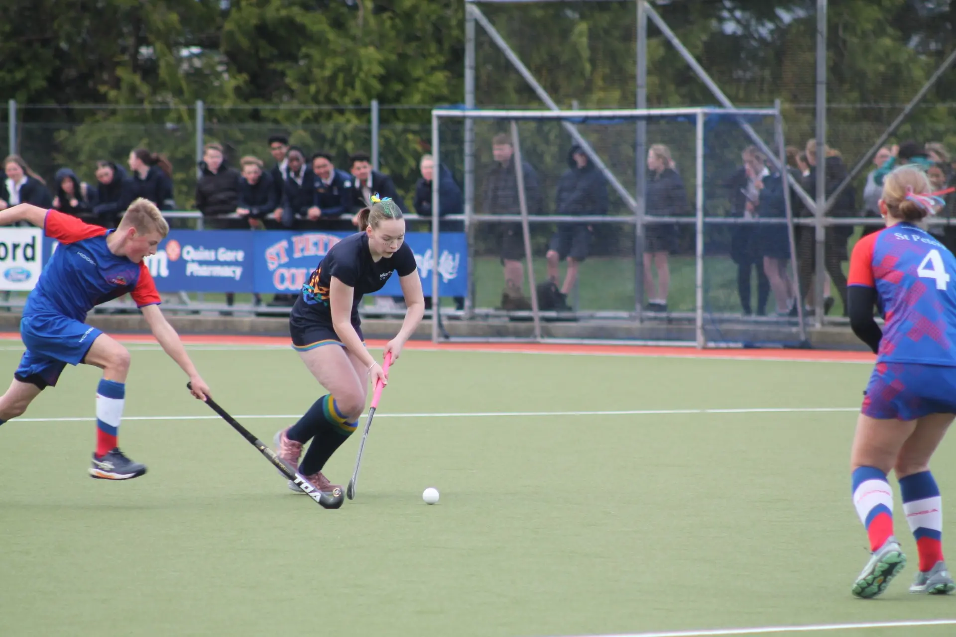 Sophie Craig, 15, of M\\u0101ruawai College, battles it out against Lee Kubala,14,  and Olivia Sanson, 14, of St Peter\\'s College, at their finals on Friday afternoon. Photo: Gerrit Doppenberg