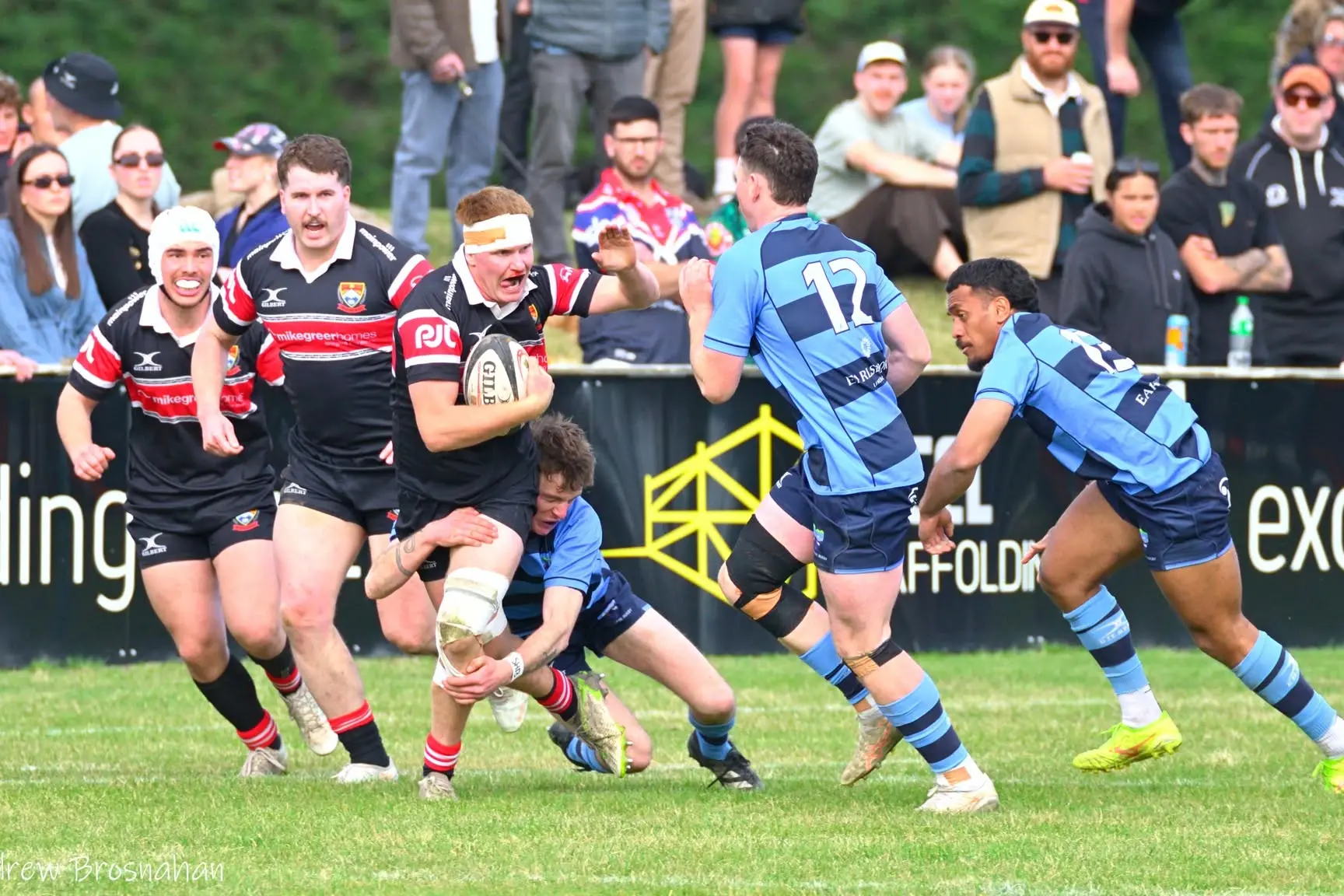 Charging on . . . An Ellesmere player stops the progress of a North Canterbury charge during the Southbridge Shield match at Rangora Showgrounds last weekend. North Canterbury won 46-35. Photo: Andrew Brosnahan