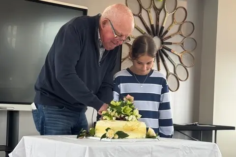 Leon O\\u2019Sullivan (left, grand nephew) and May Fowler (great great niece) cut the 150th wedding anniversary cake. Photo: Supplied