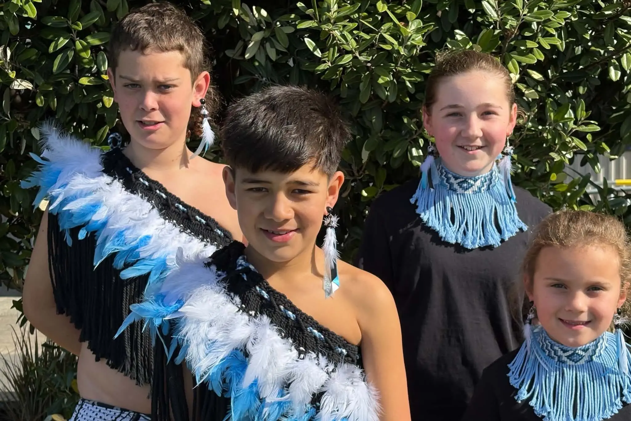 Members of St Clair School\\'s T\\u012Btike kapa haka group (from left) Nohia Vosper, 10, Knox McKenzie, 10, Meyah Scott-Stringer, 11, and Reggie Hannagan, 6, wear their new costumes, woven by wh\\u0101nau and friends of the school. Photo: supplied