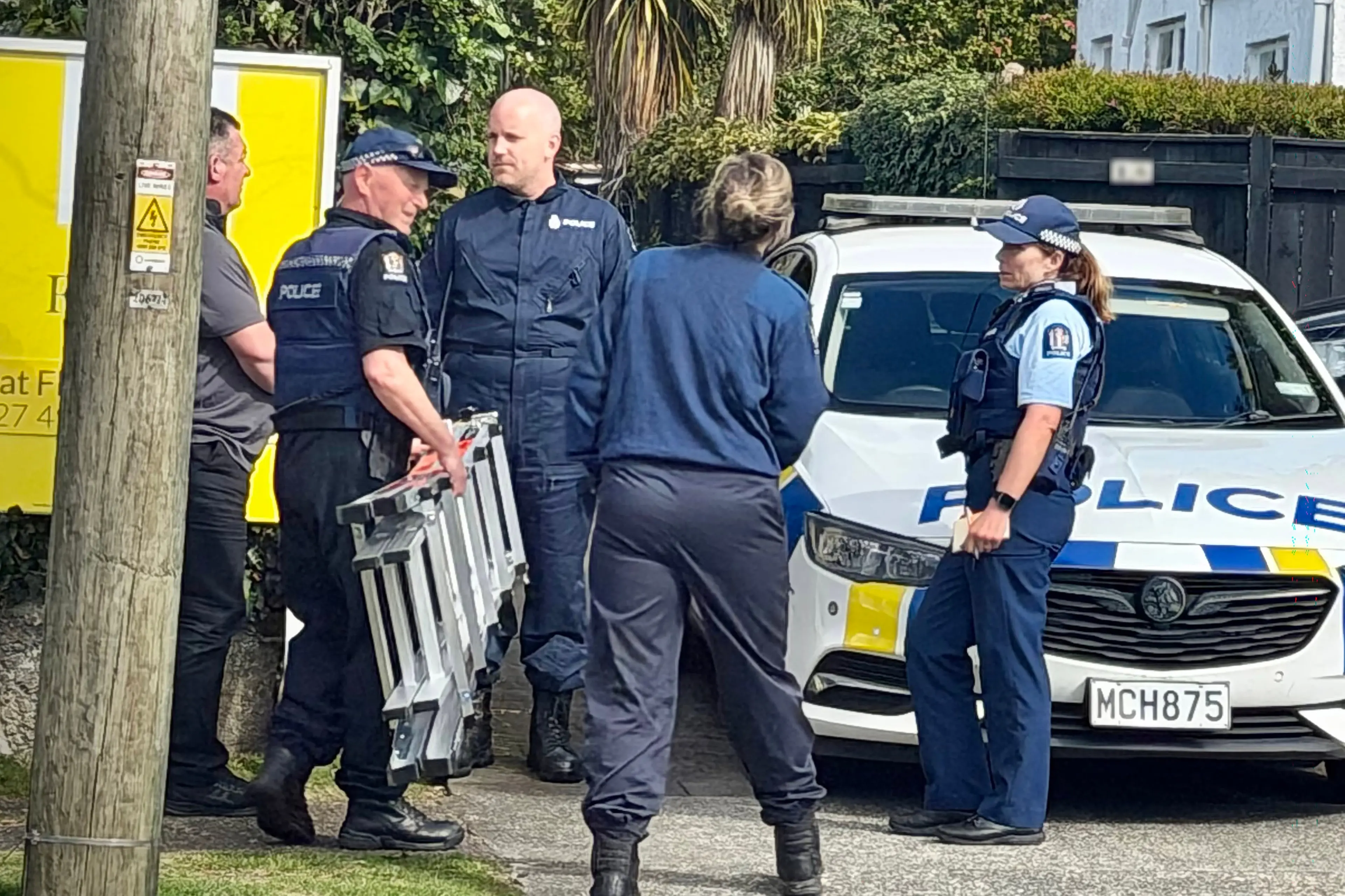 Police at the scene of the triple homicide in Rotorua. Photo: RNZ