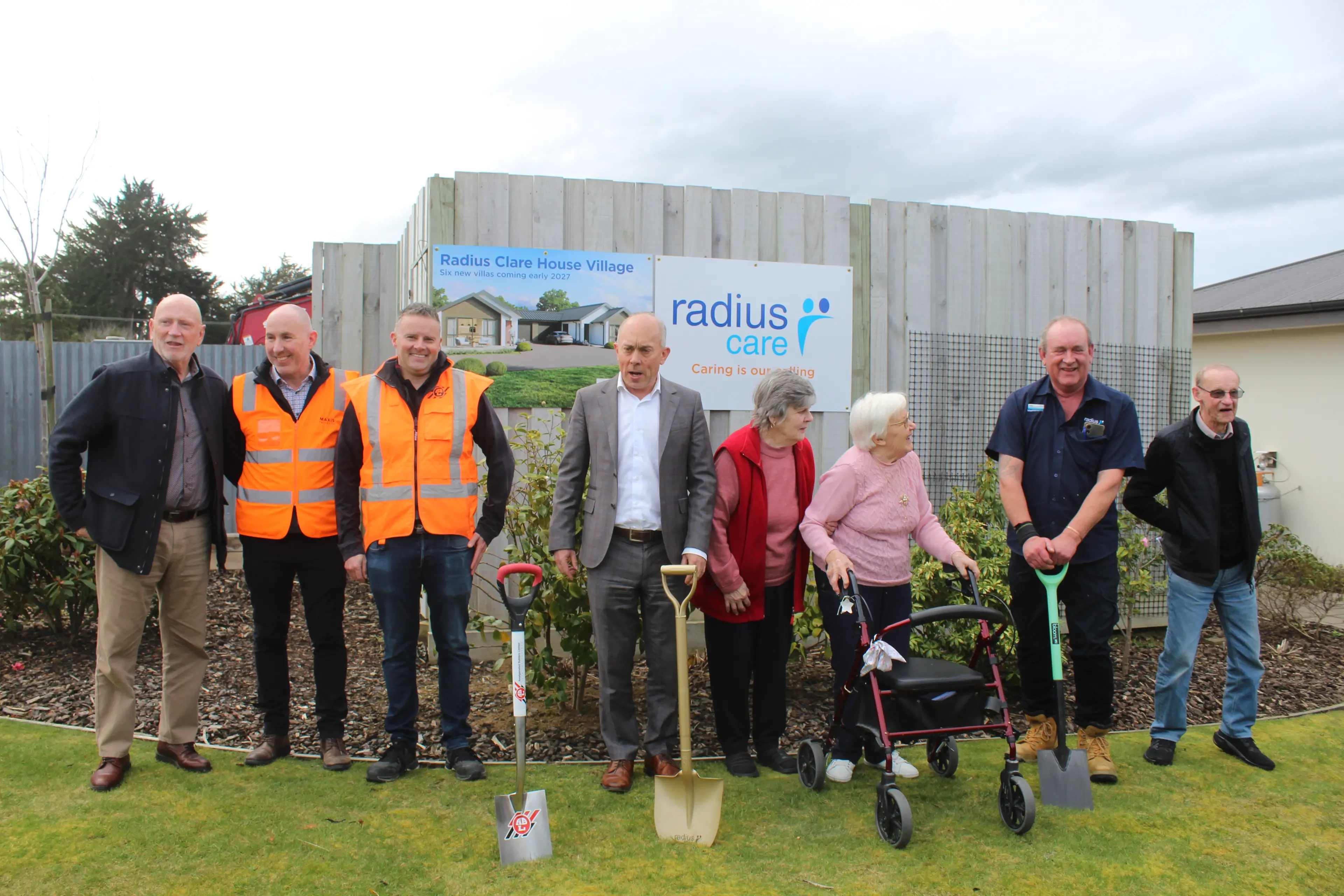 Radius Care chief executive Andrew Peskett (centre) breaks ground with builders and residents. Photo: Tayler Mutton