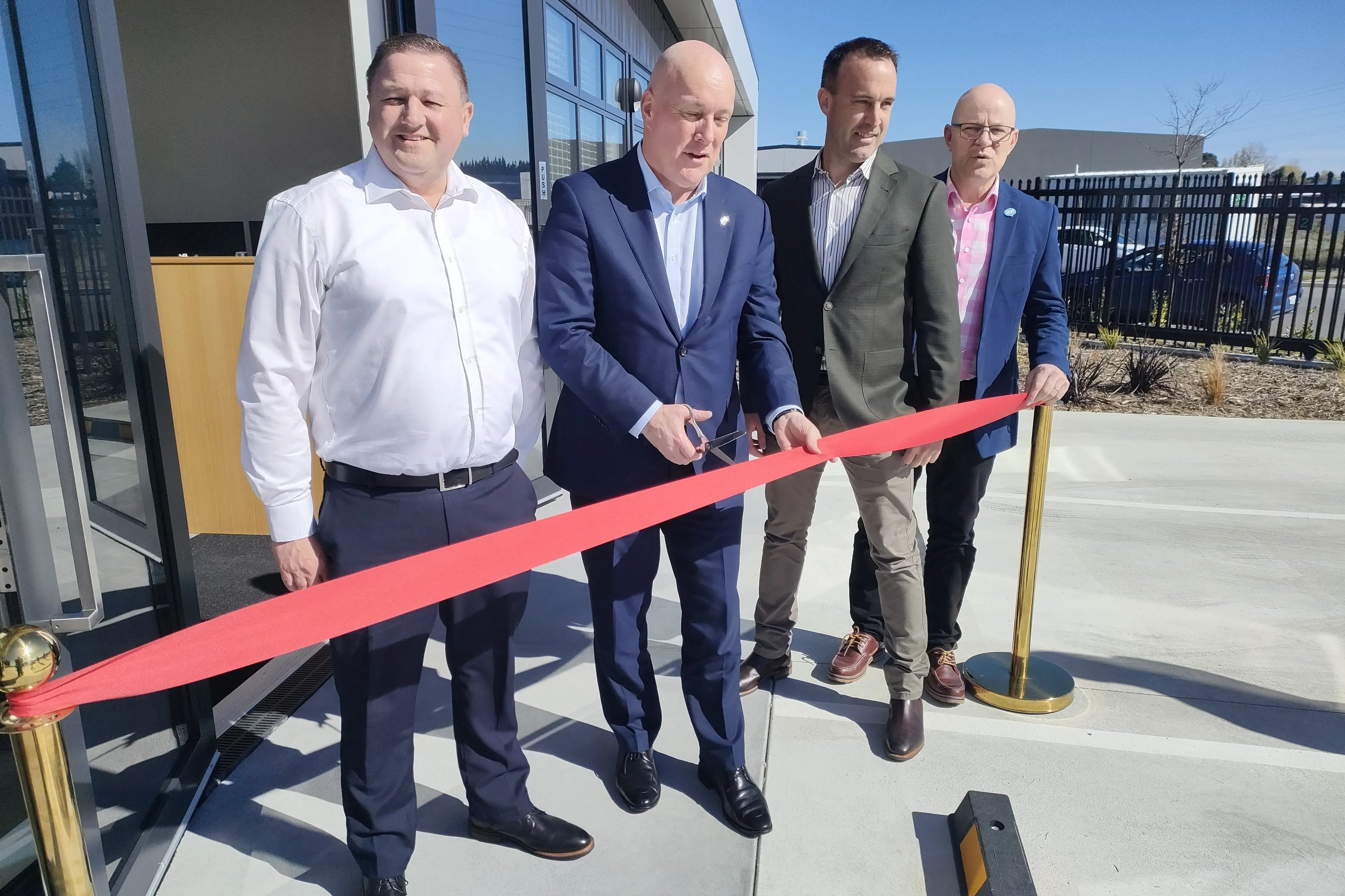 Ribbon cutting . . . Prime Minister Christopher Luxon (second left) officially opens Hallmark Group\\u2019s new factory, with the company\\u2019s directors Rick Allaway (left), Braden Hickmott and Waimakariri MP Matt Doocey. Photo: David Hill