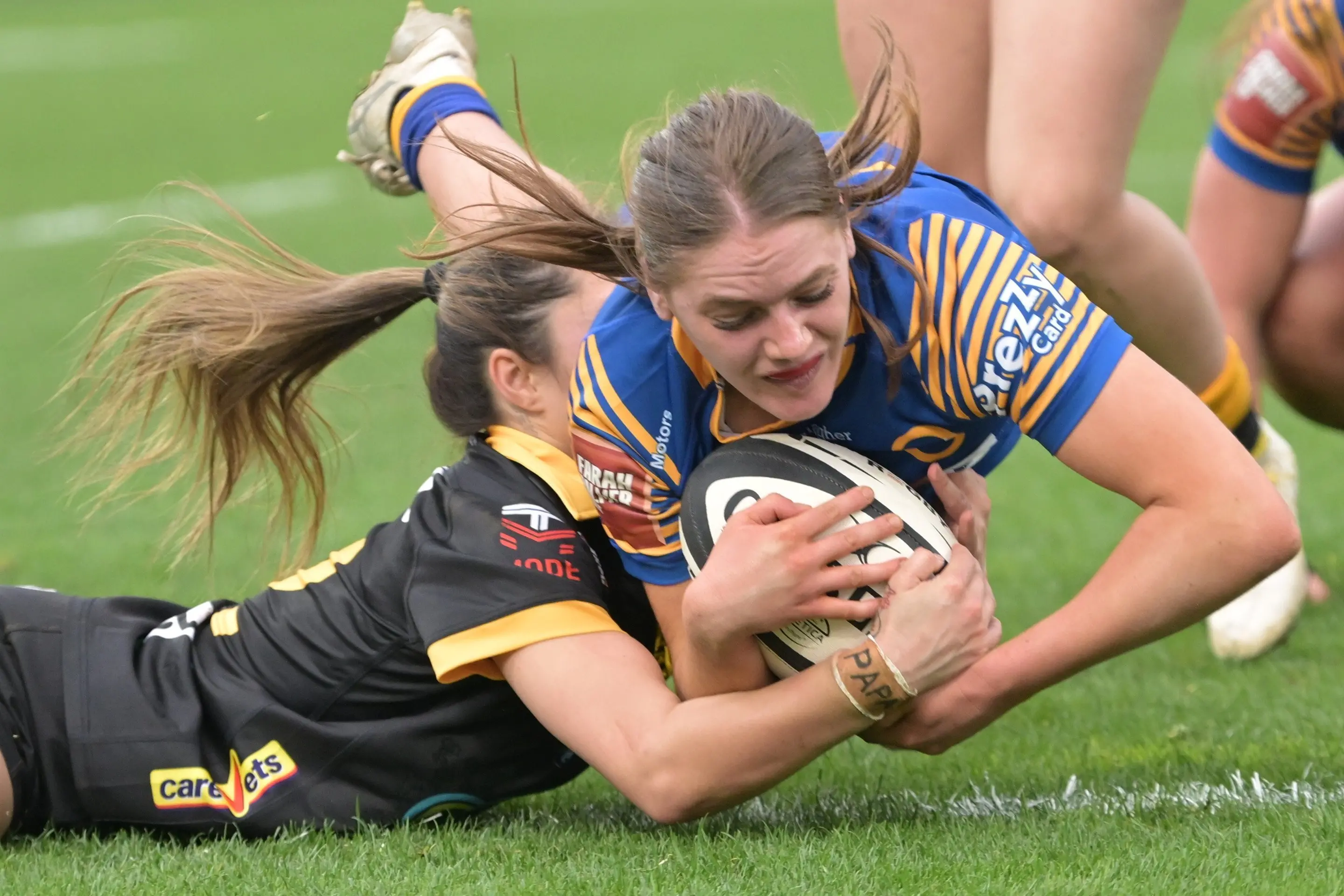 Halfback Charli Sinclair scores on debut for the Otago Spirit, while Wellington Pride defender Nia Sutherland tries to stop her at Forsyth Barr Stadium. Photo: Gerard O\\'Brien