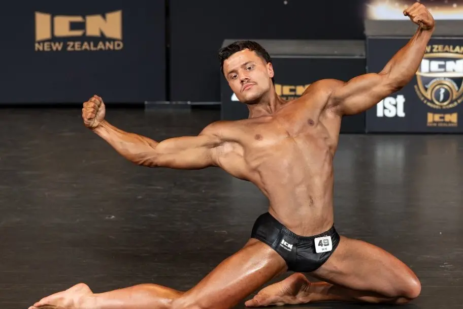 University of Otago health sciences student Aanakyn Williams-Harris on stage at the ICN South Island U23 Classic Physique competition. Photo: Rob Caven