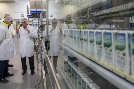 Prime Minister Christopher Luxon is shown through the factory by Goodman Fielder NZ chief executive Bernard Duignan during the official opening of the Meadow Fresh High Value Dairy Centre in Upper Riccarton, Christchurch. Photo: Peter Meecham
