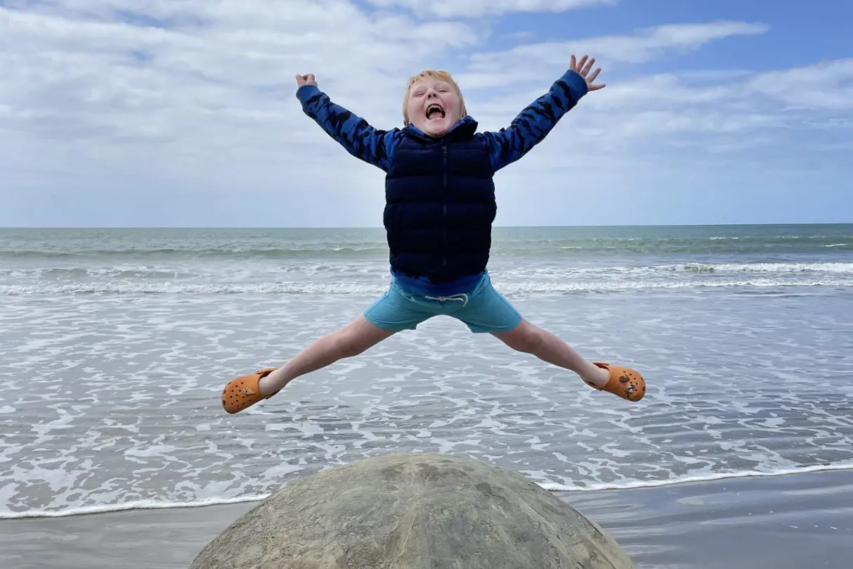 The sky\\u2019s the limit for Ethan Conlan, 6 at the time, at the Moeraki Boulders (Kaihinaki) on January 8. Tourism Waitaki is now celebrating increases in visitation numbers that are outpacing most of the rest of the country. PHOTO: JANELLE CONLAN