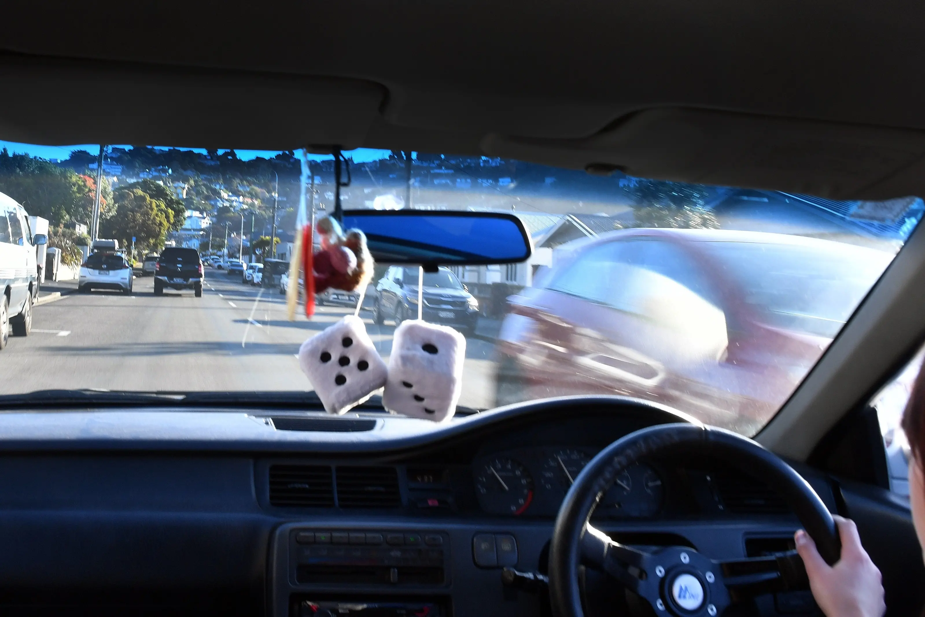 A young person in their modified car drives along Victoria Rd. Photo: Stephen Jaquiery