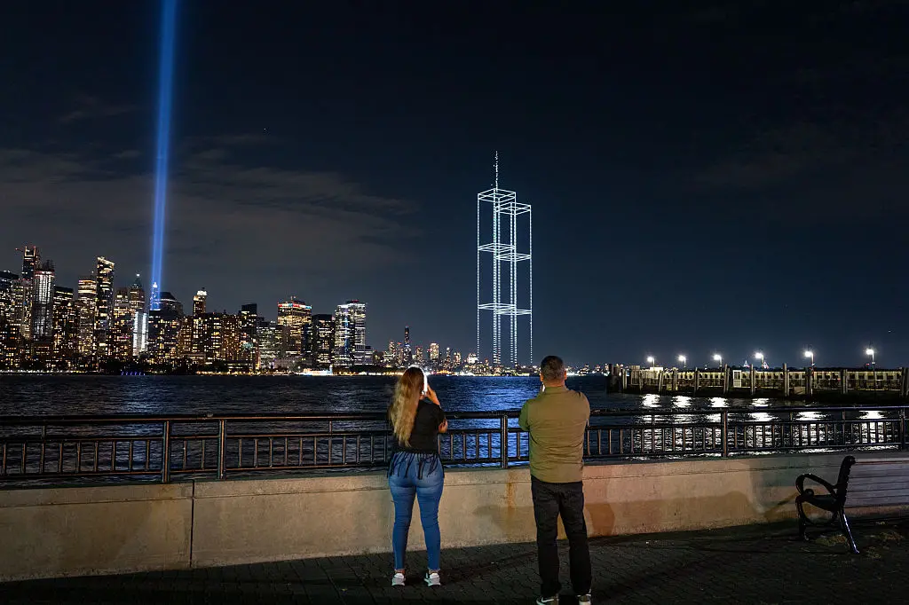 A drone light show depicting the World Trace Center\\'s twin towers appears in the skyline during testing of the Tribute in Light installation in lower Manhattan, New York. Photo: Getty Images