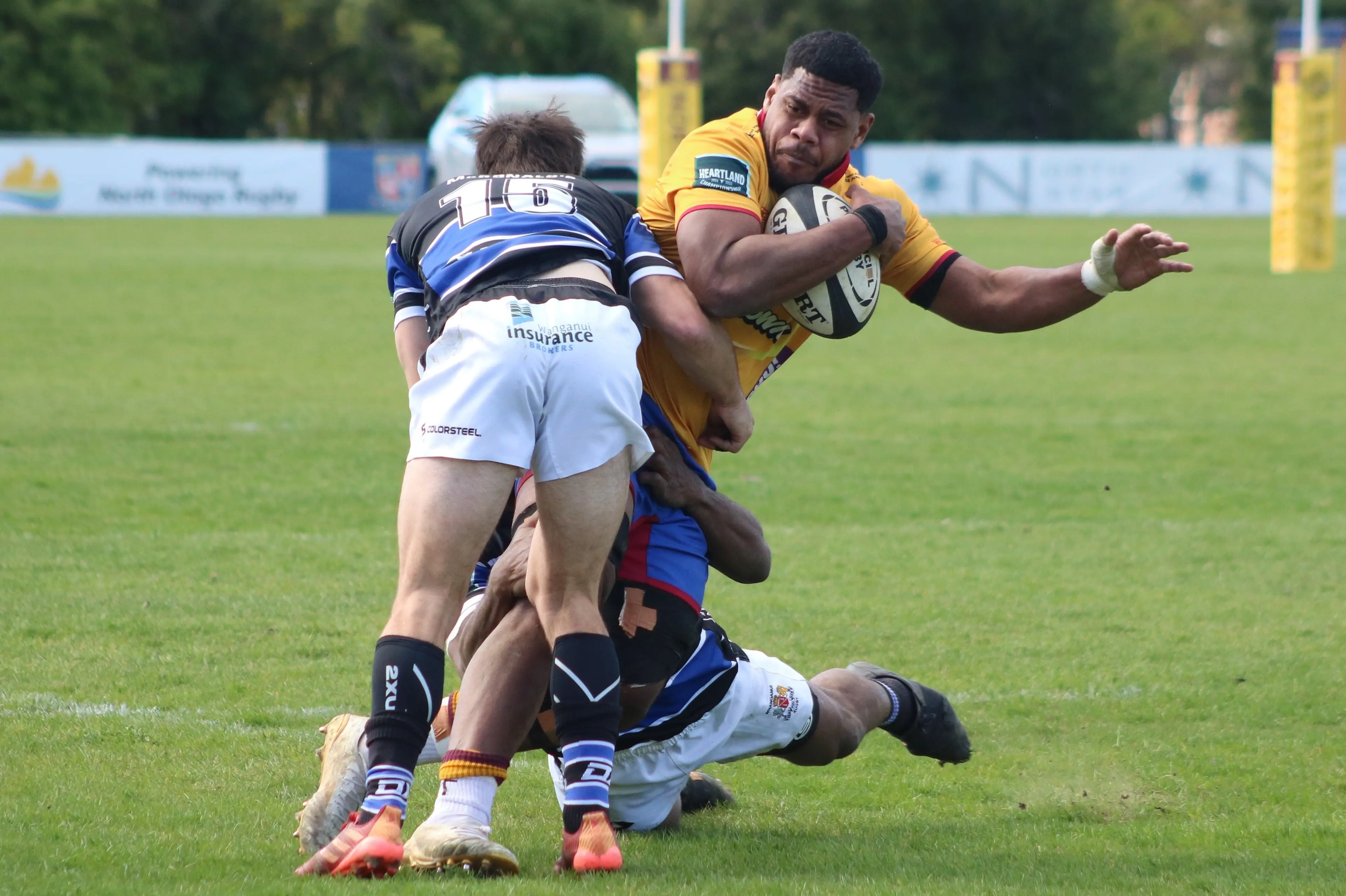 North Otago captain Savenaca Rabaka holds on to the ball in the tackle of Whanganui backs Juan Tantrum and Beniamino Vota (obscured) during their Heartland Championship clash in Oamaru on Saturday. Photo: Kayla Hodge