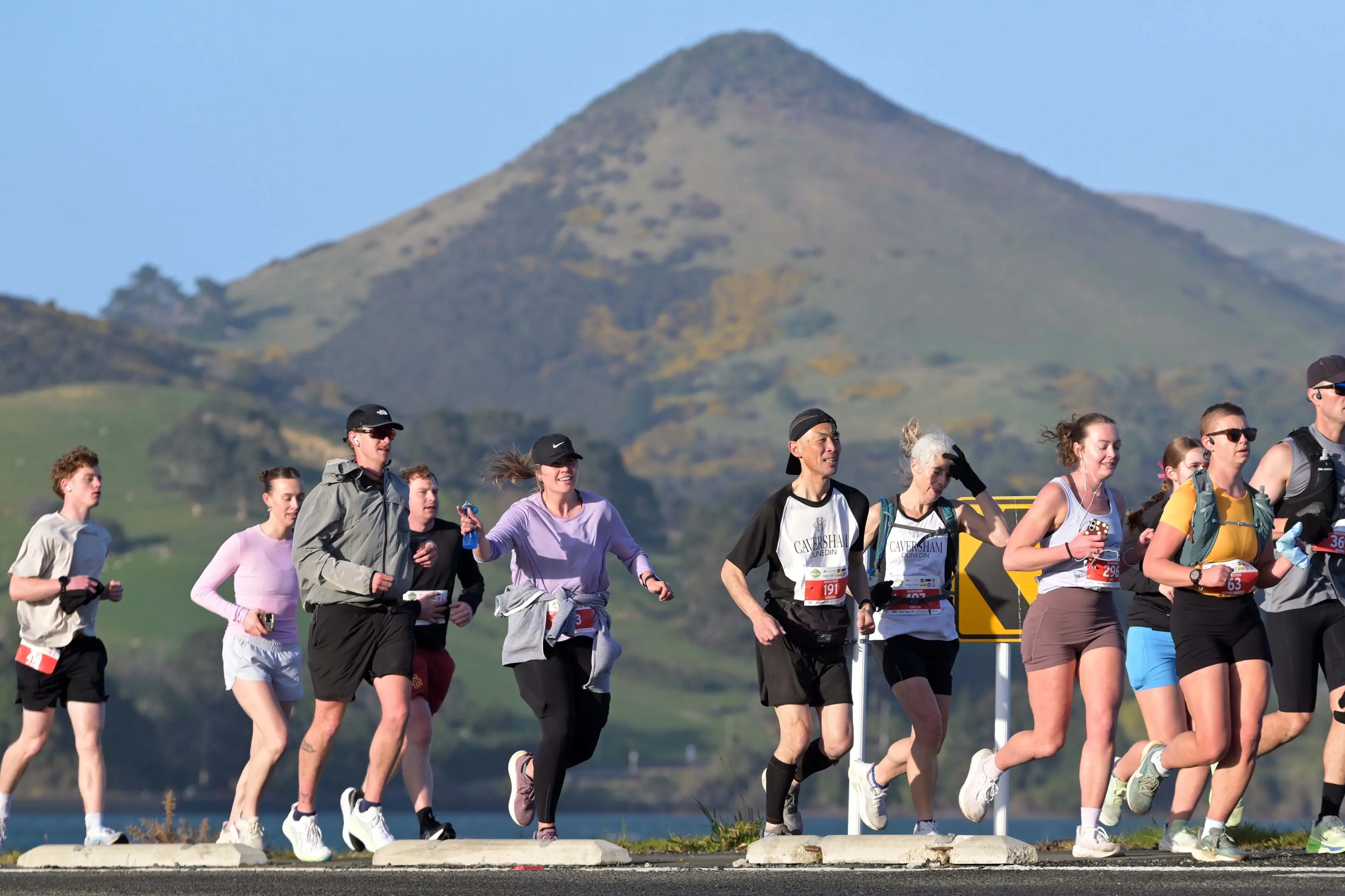 Runners pass near Harwood during the Dunedin Marathon on Sunday morning. Photo: Gerard O\\'Brien