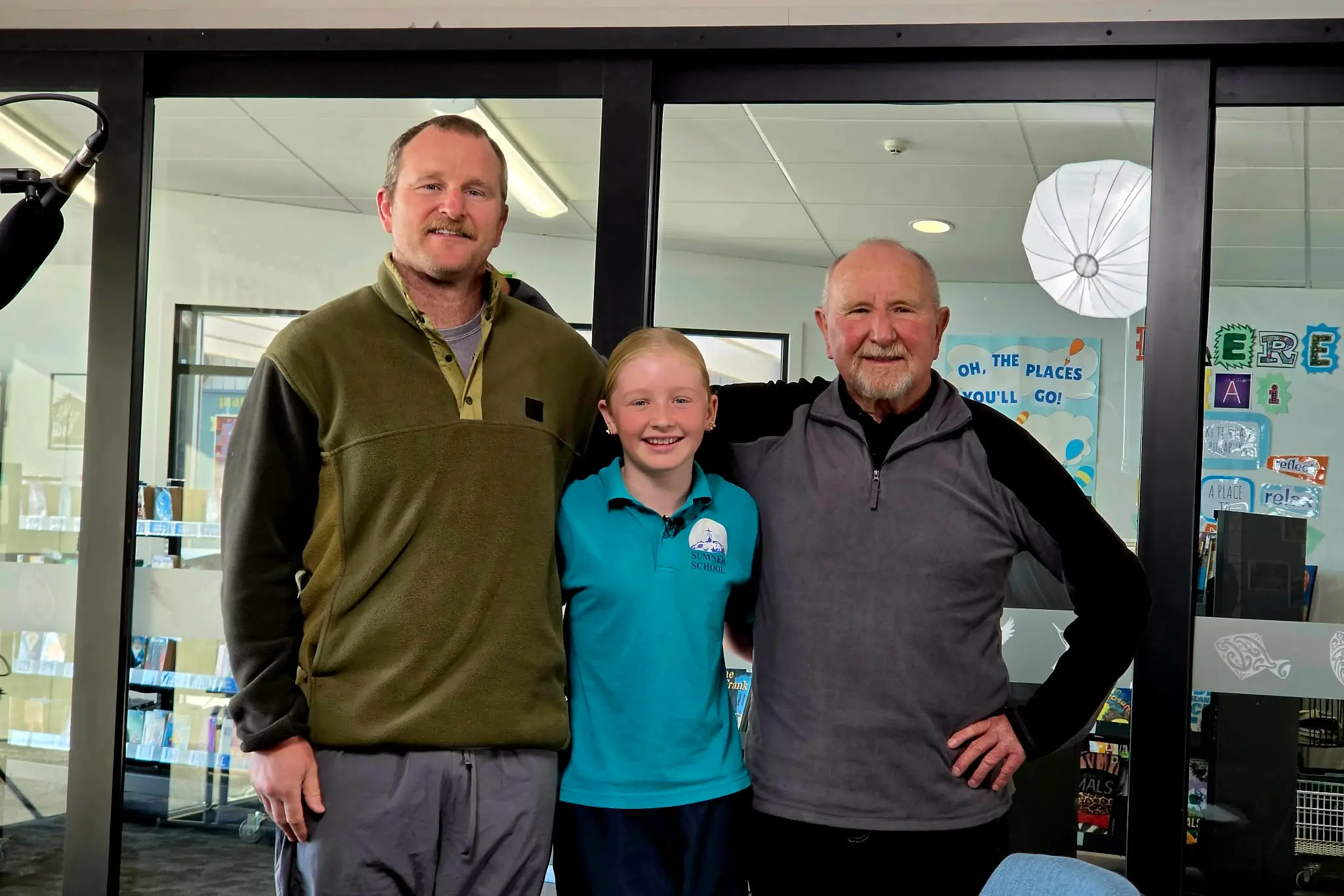 Three generations of Sumner School students, James, Evie and Russell Craw. Photo: Supplied