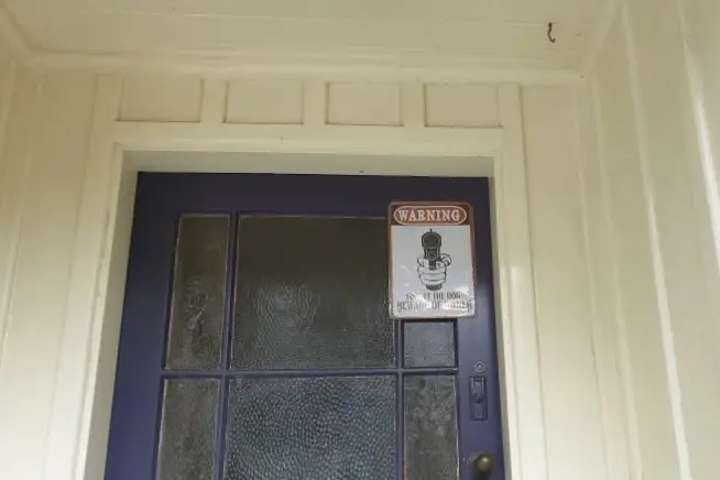 A notice on the door of Troy Dubovskiy\\'s Christchurch home, pictured the day after his death. Photo: Karen Brown
