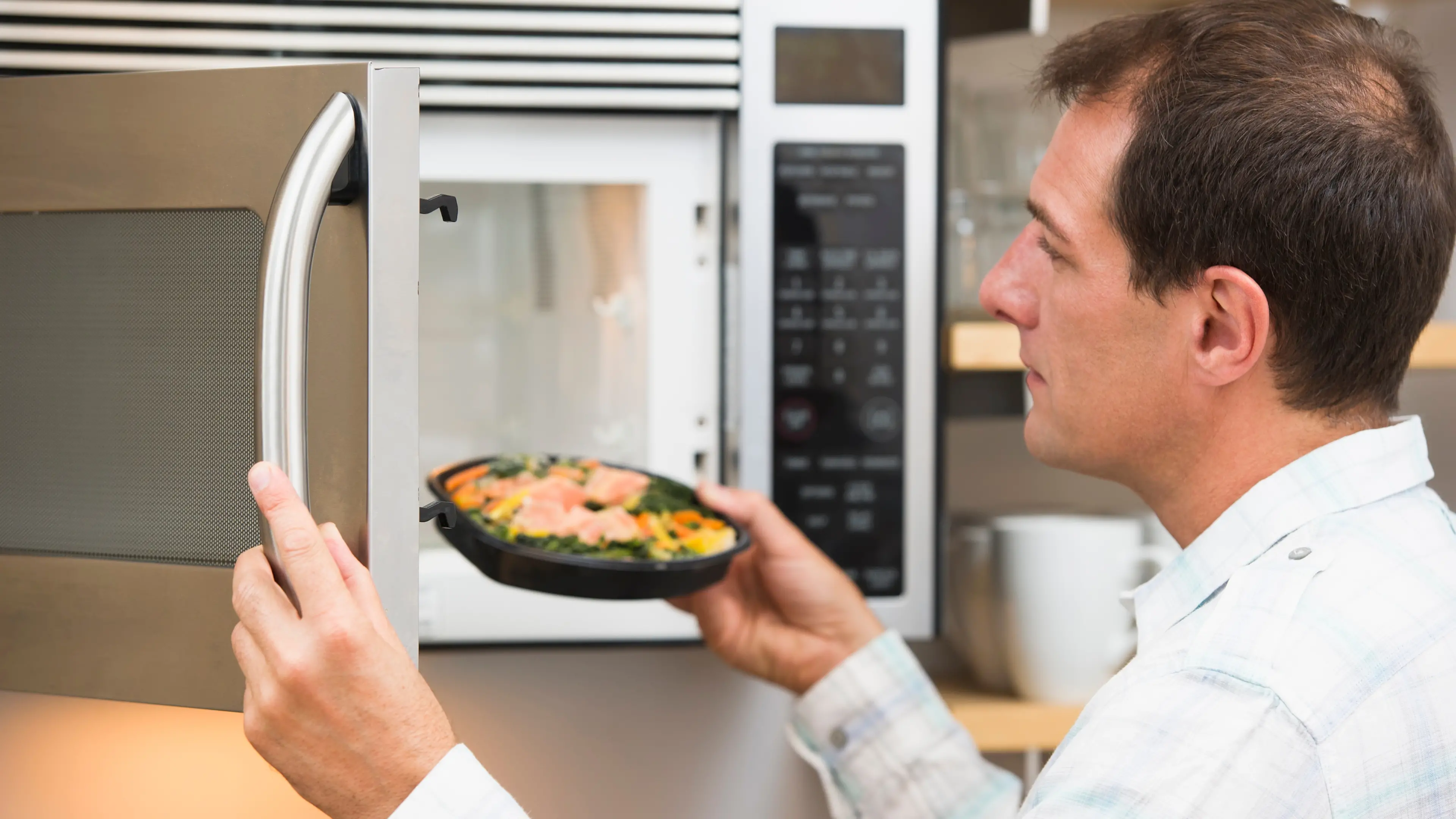 Why does microwaving fish smell so bad?