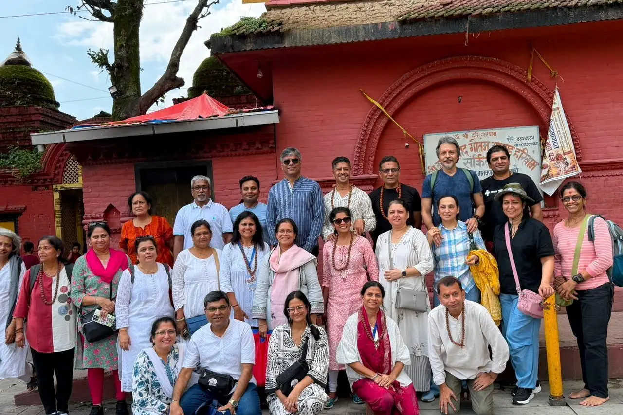 Arushi Gupta poses for a photograph with a group of pilgrims outside a temple in Kathmandu, Nepal, in this image shared with her father on August 24. Photo: Gupta Family/Handout via REUTERS