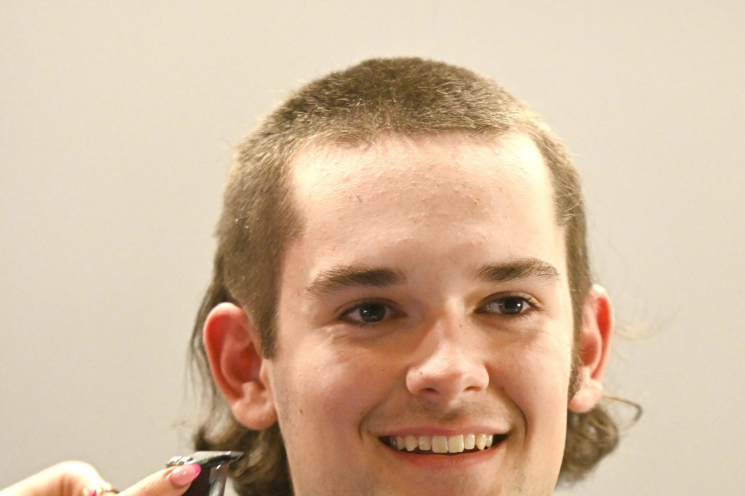 Eli Meikle had his hair cut by Ella-Rose Ryan. Several Taieri College students and some teachers got their locks cut off for a good cause on Thursday, raising nearly $5000 for Blood Cancer NZ . Photo: Linda Robertson