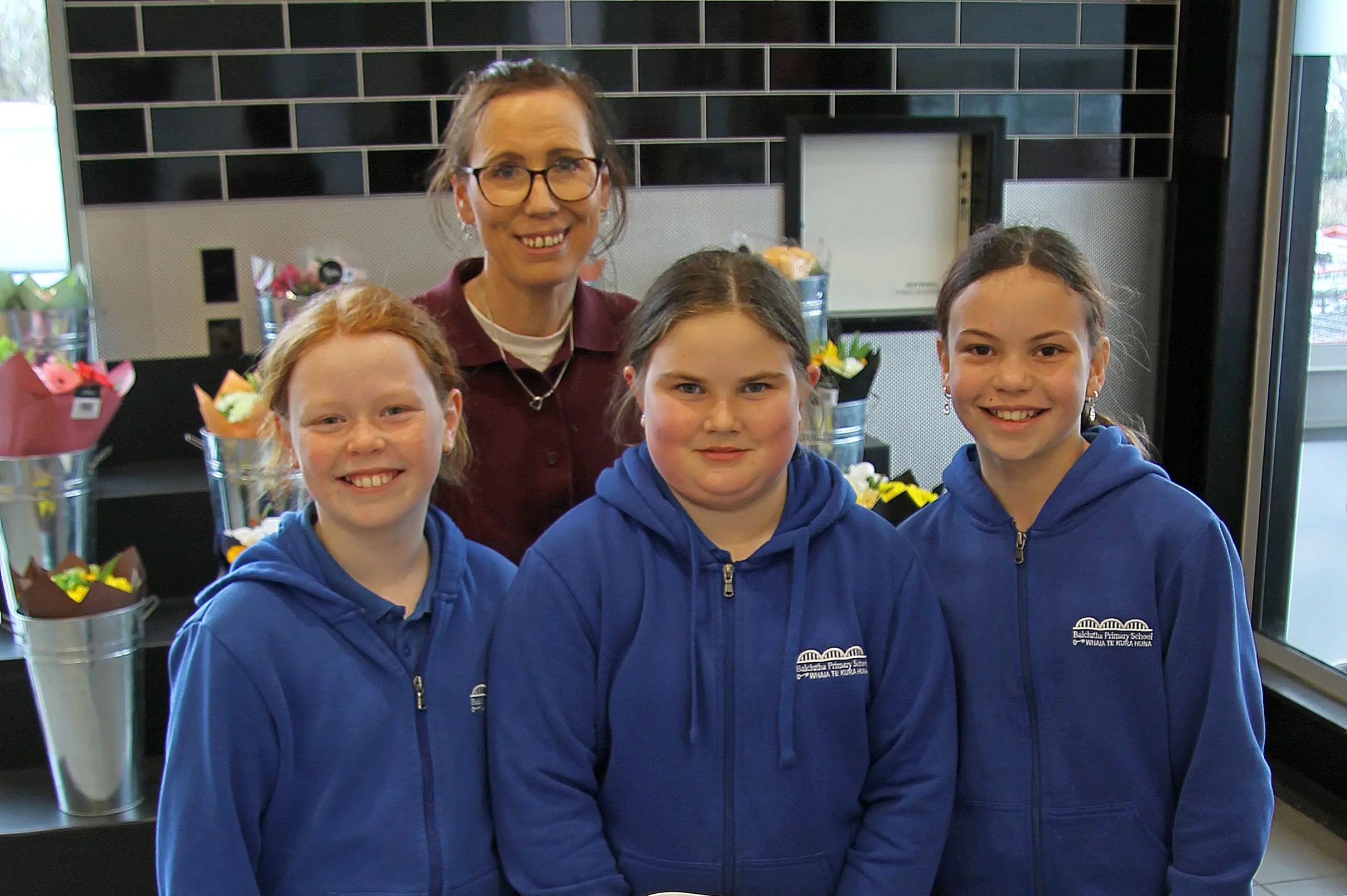 Balclutha Primary School\\u00A0Year 7 & 8 students\\u00A0Sophie Cook, Emily Sutherland, Tilly Field and teacher Cathy Haar traded luxury cupcakes for gold-coin SPCA donations at their local supermarket on Wednesday, September 16. Photo: Nick Brook