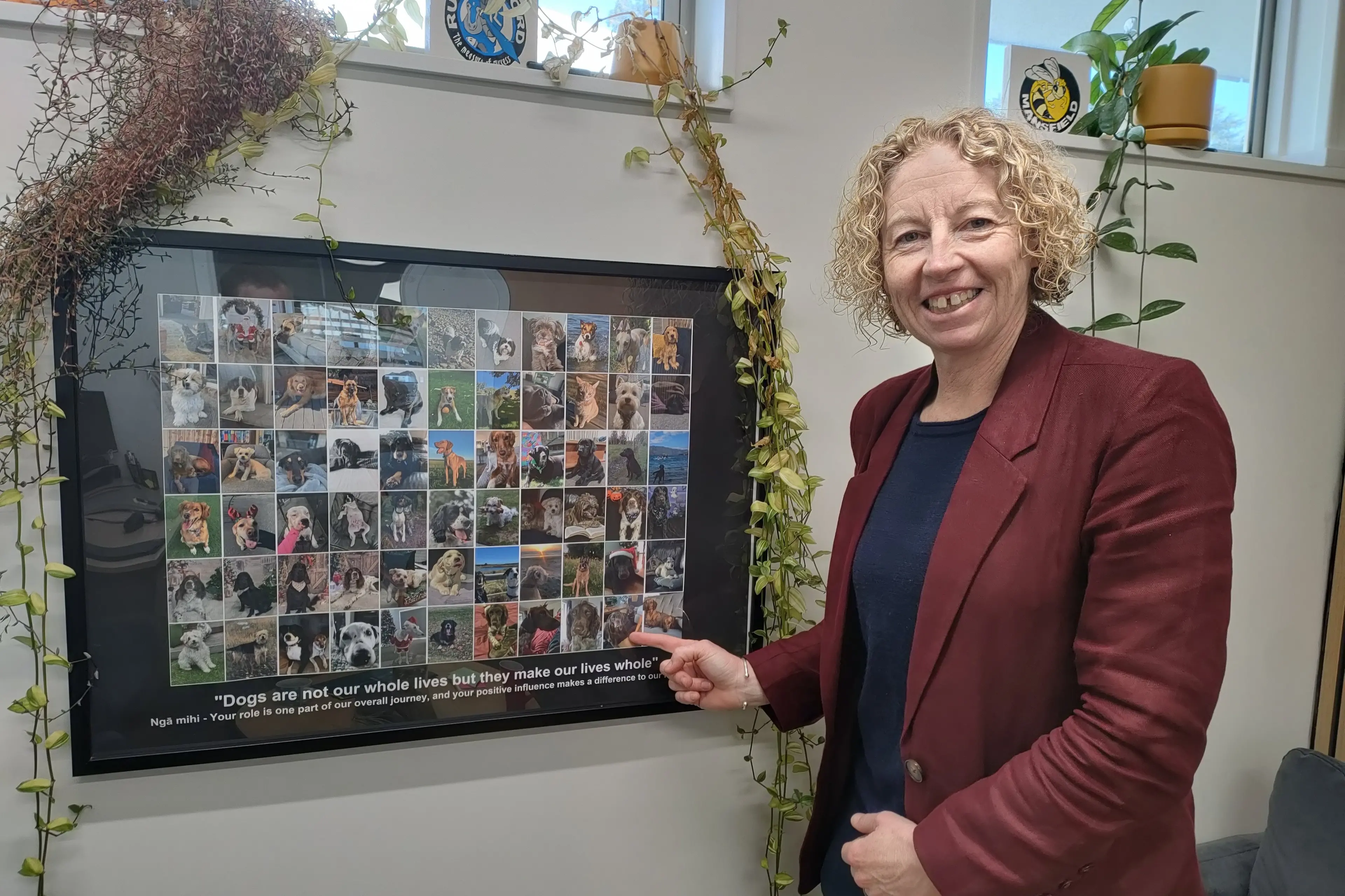 Pride of place . . . Haidee Tiffen plans to take this collage of photos of dogs (and one cat), which are the pets of staff at Rangiora High School, into her new office. Photo: David Hill