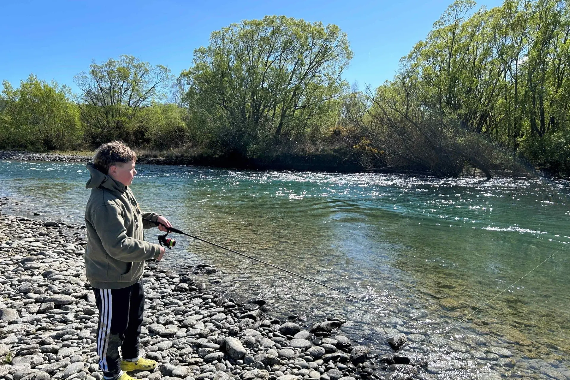 Jackson Collins, of Oamaru, 15, fishing the Waitaki River near Kurow on the opening day of sport fishing season last year. PHOTO: BLAKE HARPER/FISH & GAME