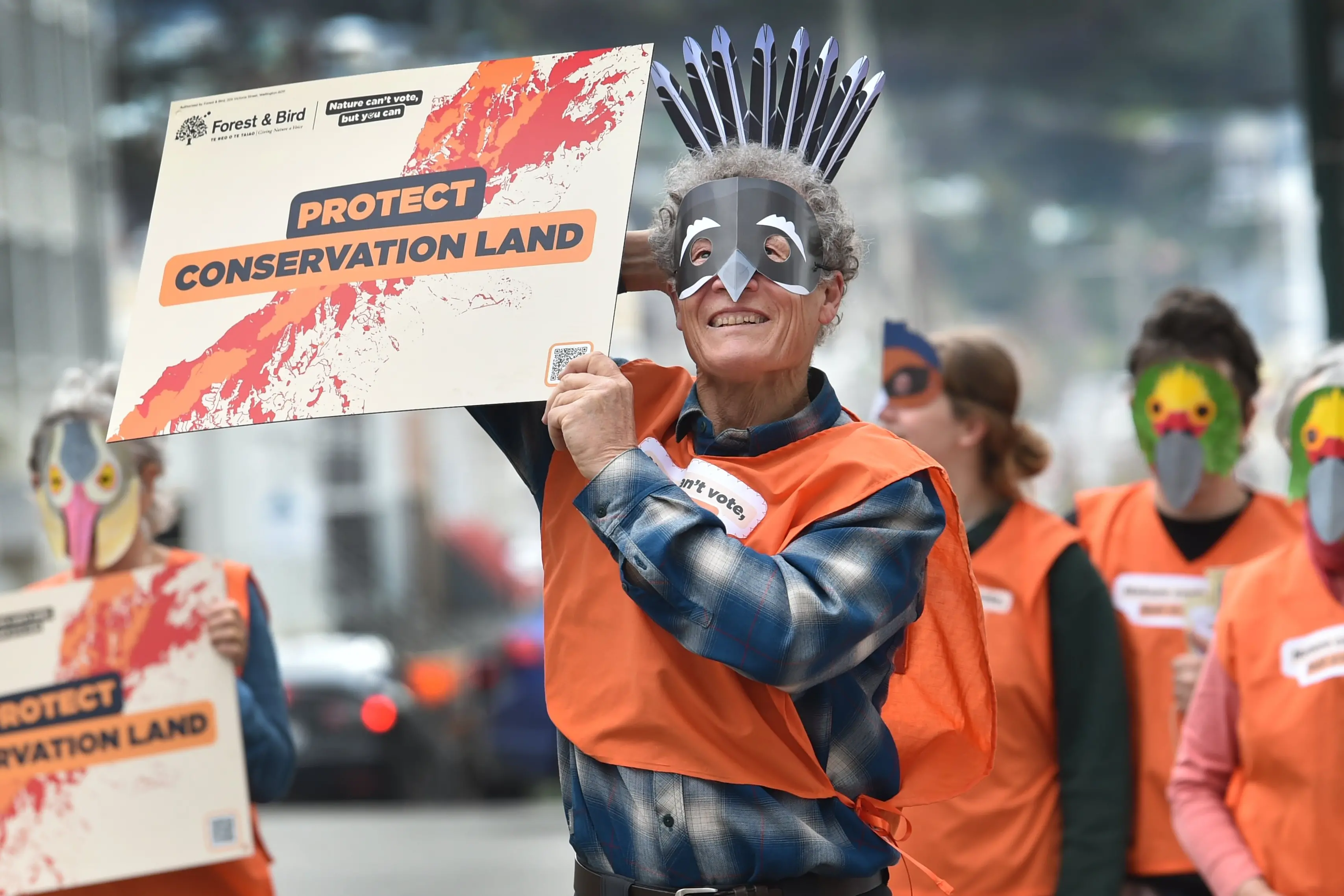 Forest & Bird Dunedin branch member Graeme Loh holds a sign during the organisation\\'s \\u201Cvote for nature\\u201D rally in the Octagon on Saturday. Photo: Peter McIntosh