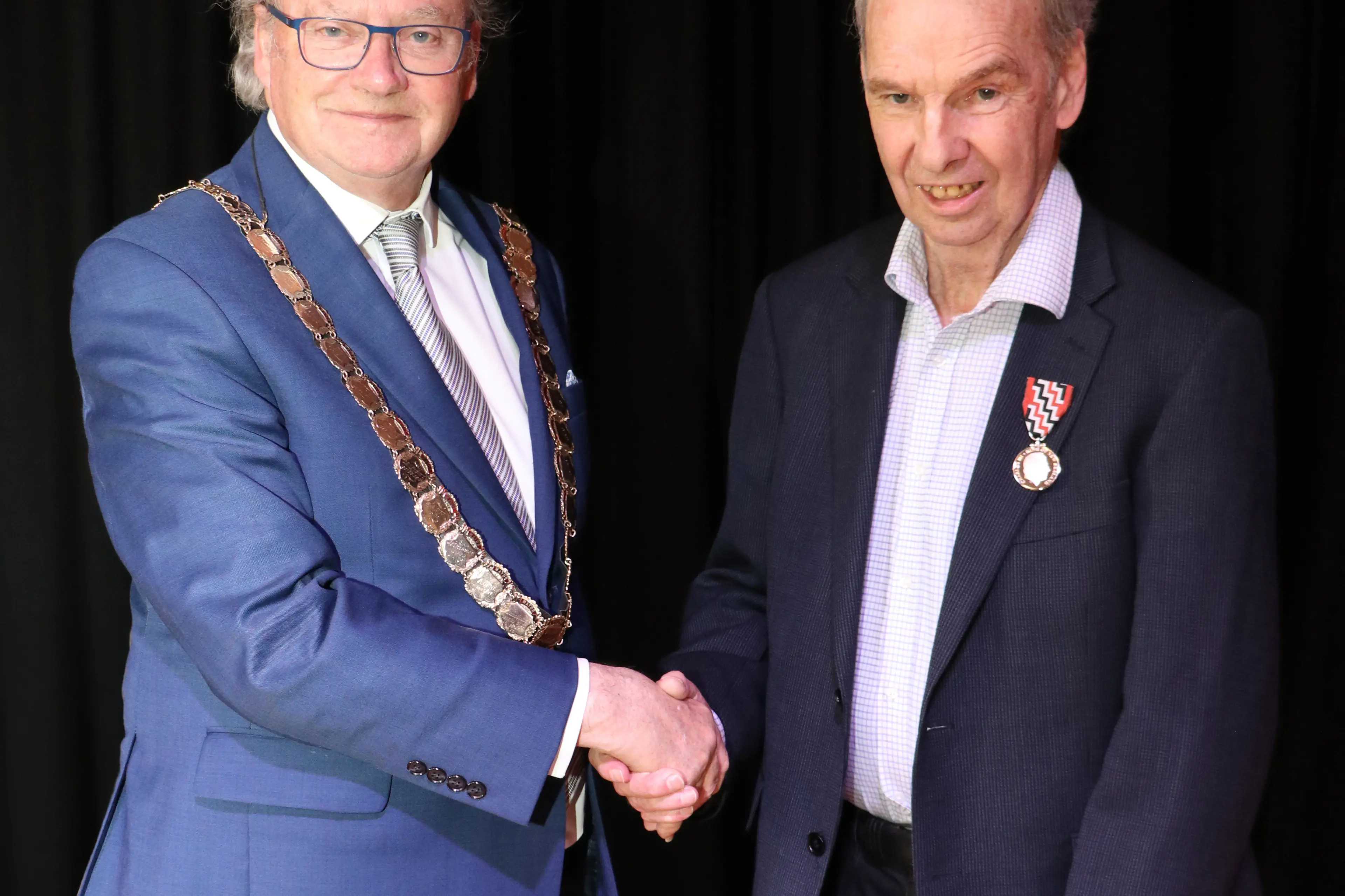 Invercargill Mayor Tom Campbell presenting Bill Donaldson with his King\\'s Service Medal. Photo: SUPPLIED