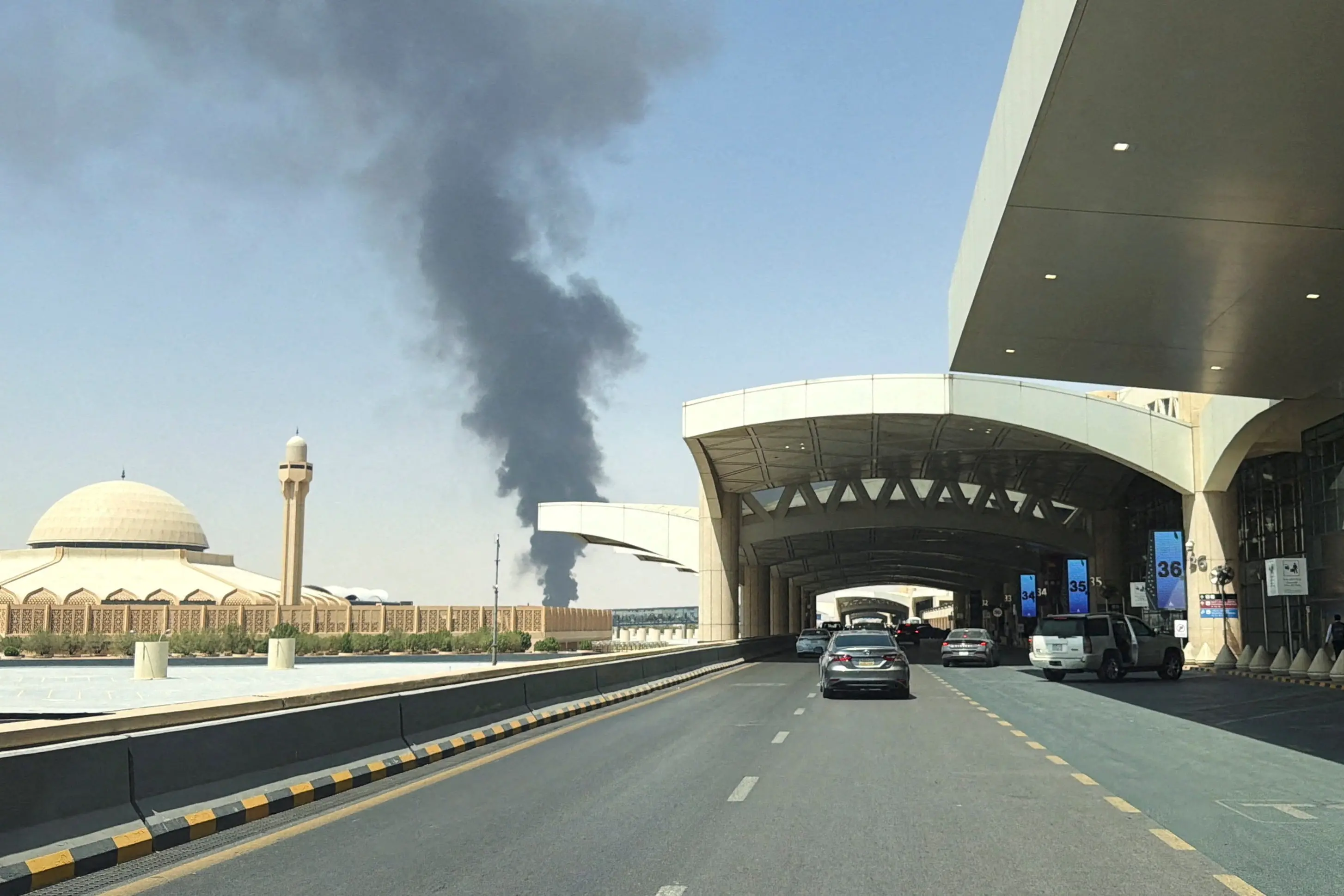 <p>Large plume of black smoke rises from the fuel storage area at King Khalid International Airport, in Riyadh, Saudi Arabia. Photo: Reuters</p>\\n