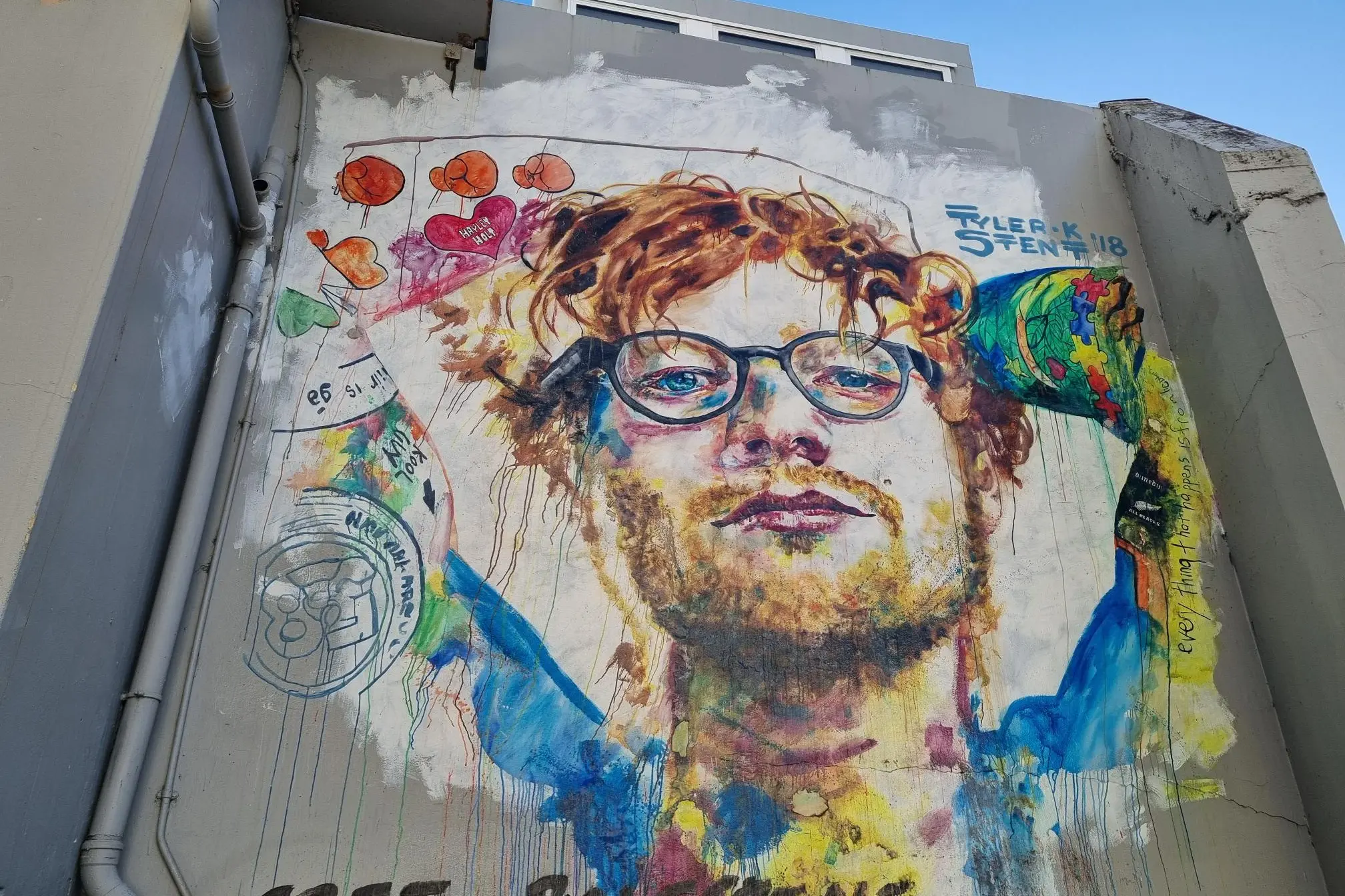 The words \"Free Palestine\" have been written on the mural.