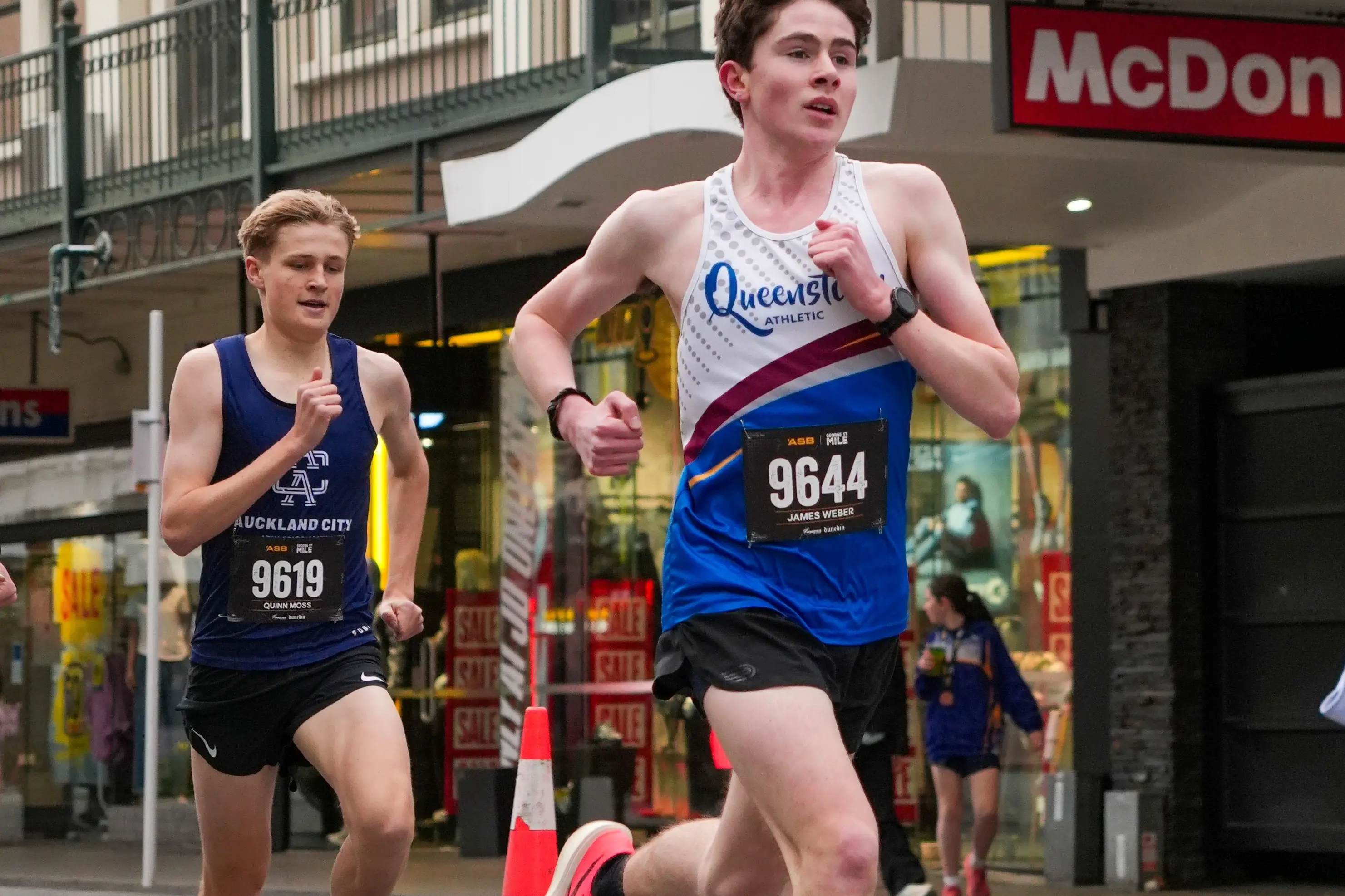 Powering through: James Weber on his way to winning the NZ\\u00A0U20 mile road champs in Dunedin. Photo: Tom Williams