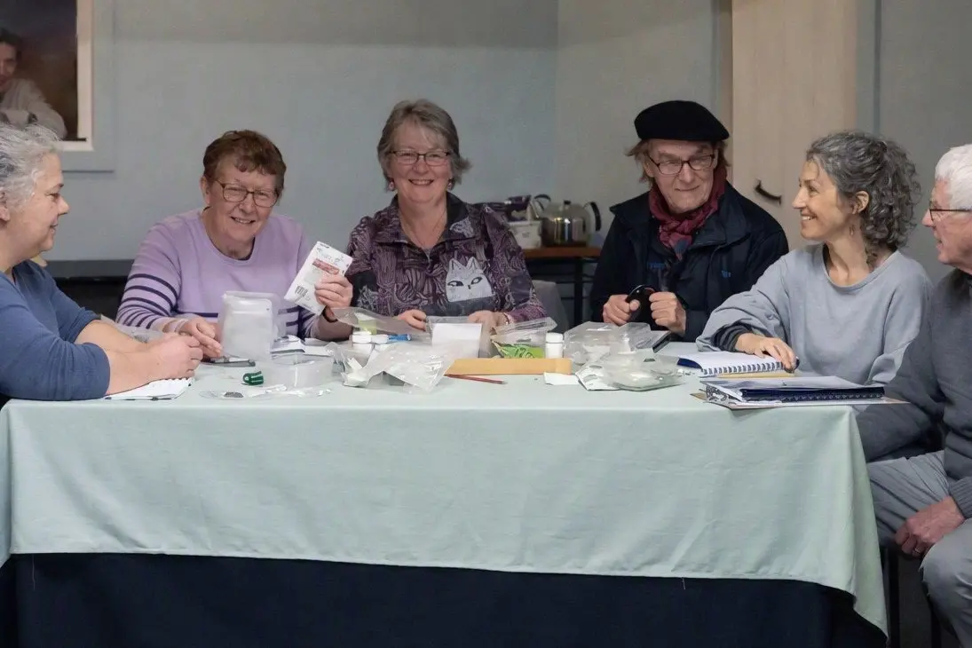 Dodgy goings on are suspected at the garden club, as the committee meets to discuss fundraising, in this scene from Tim Hambleton\\'s Gone to Seed, on now at Mosgiel\\'s Fire Station Theatre. Pictured are (from left) Miriama Harman, Kay Masters, Alison Ayers, Peter Whigham, Anne-Marie Amende, and Doug Leggett, with Cheyne Jenkinson (at the window). Photo: Star files