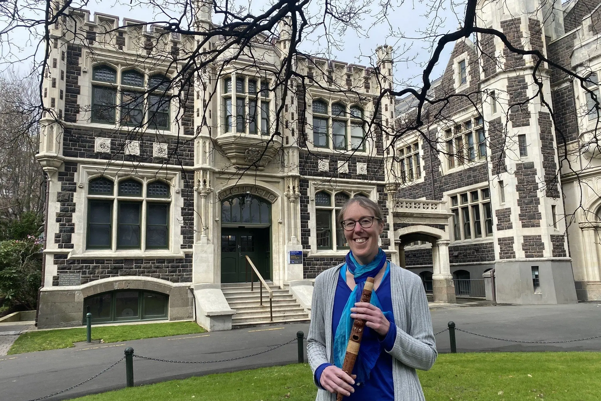 University of Otago School of Performing Arts Head and ethnomusicologist, Associate Professor Jen Cattermole, is flanked by Marama Hall on campus, where events will be held to celebrate the 100th anniversary of the music department this weekend. Photo: Brenda Harwood