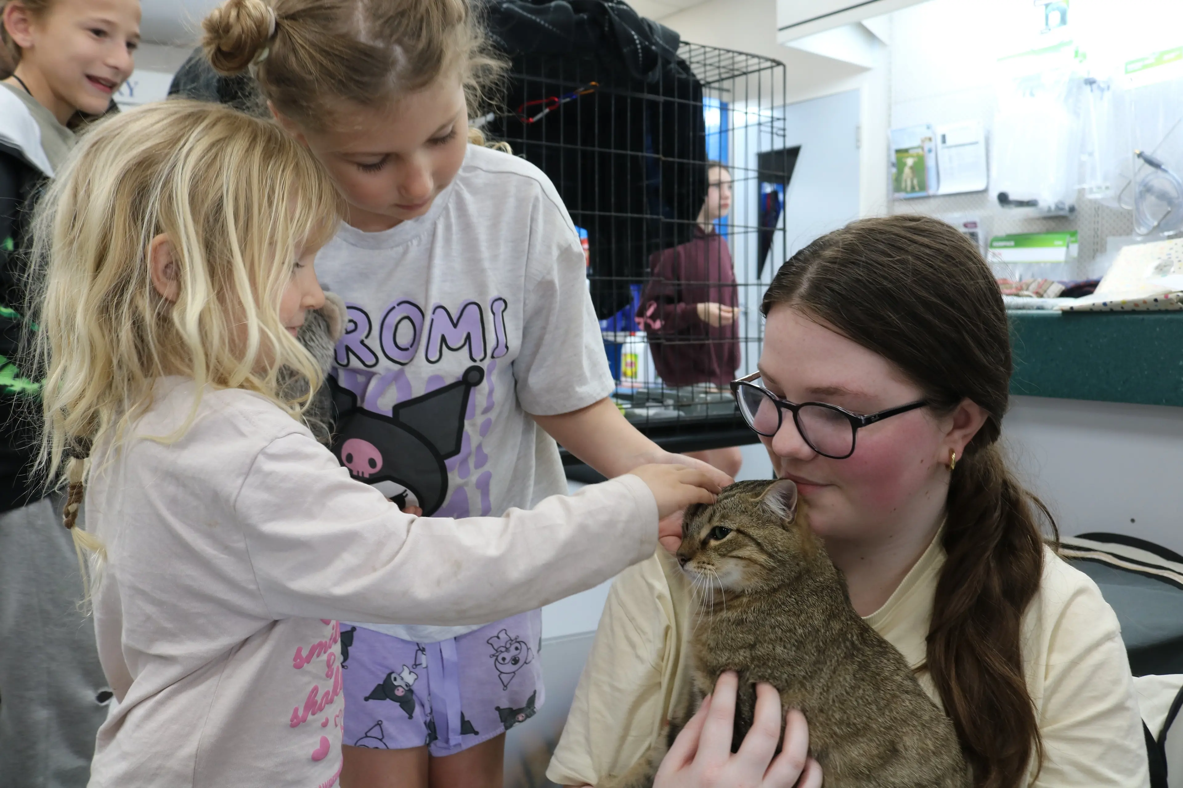 Fosterer\\u00A0Imogen White holds Monday the kitten who received\\u00A0adoring attention from sisters Agna, 7 and Ava, 4 Elliot at the PussN Boots Kitty Rescue adoption day at By The Big Blue Cross Veterinary Centre in Oamaru on Tuesday. Photo: Jules Chin