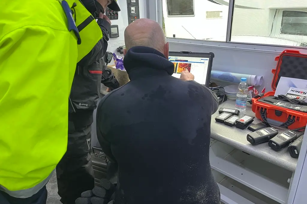 Police analyse an image taken during the search of Lake Moeraki on Tuesday. Photo: NZ Police