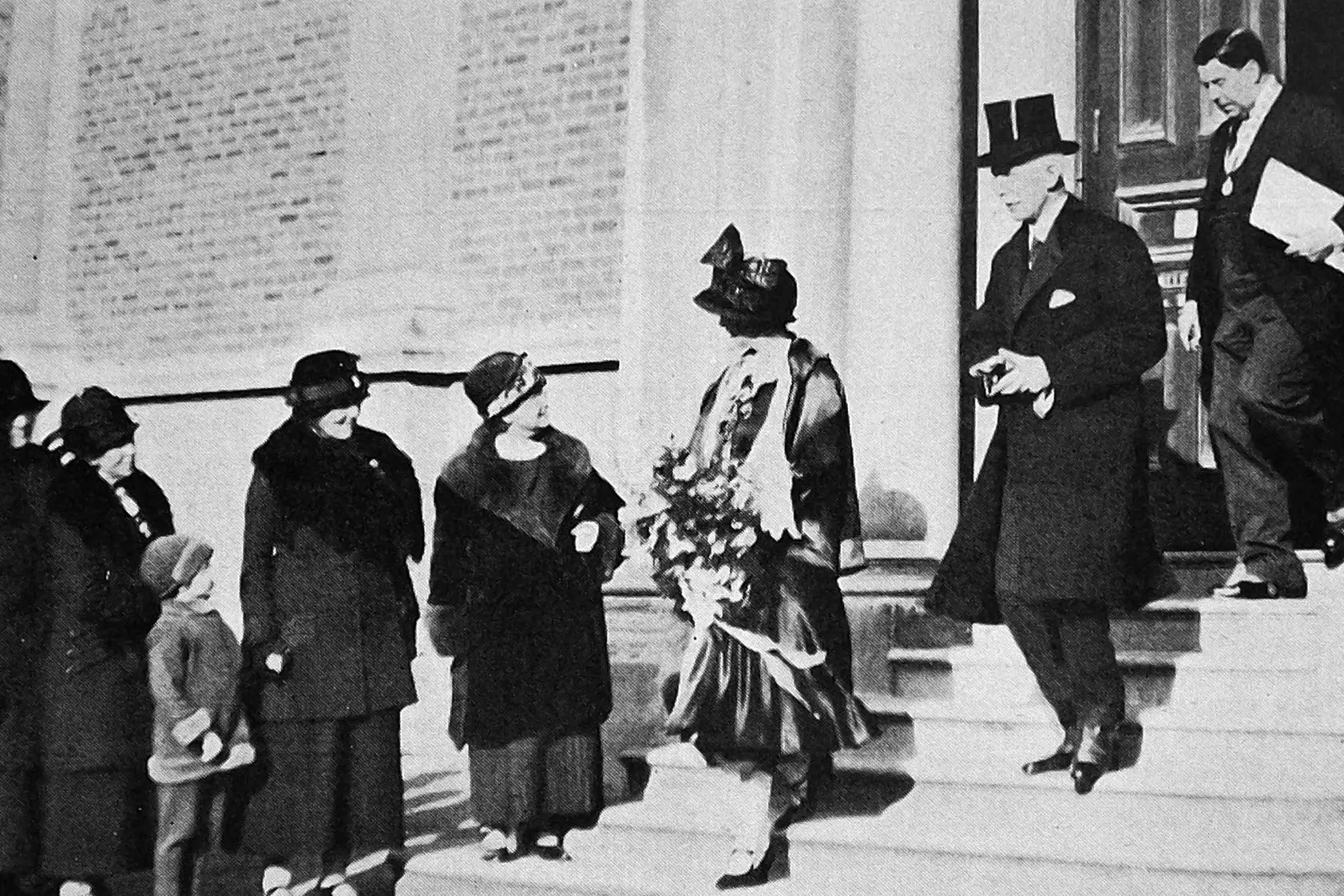 Governor-General Sir Charles Fergusson and Lady Alice Fergusson, followed by Dunedin Mayor Harold Tapley, leave the Art Gallery (now part of Toit\\u016B Otago Settlers Museum) after a public reception. Photo: <i>Otago Witness</i>, issue 3789, October 26, 1926, page 44