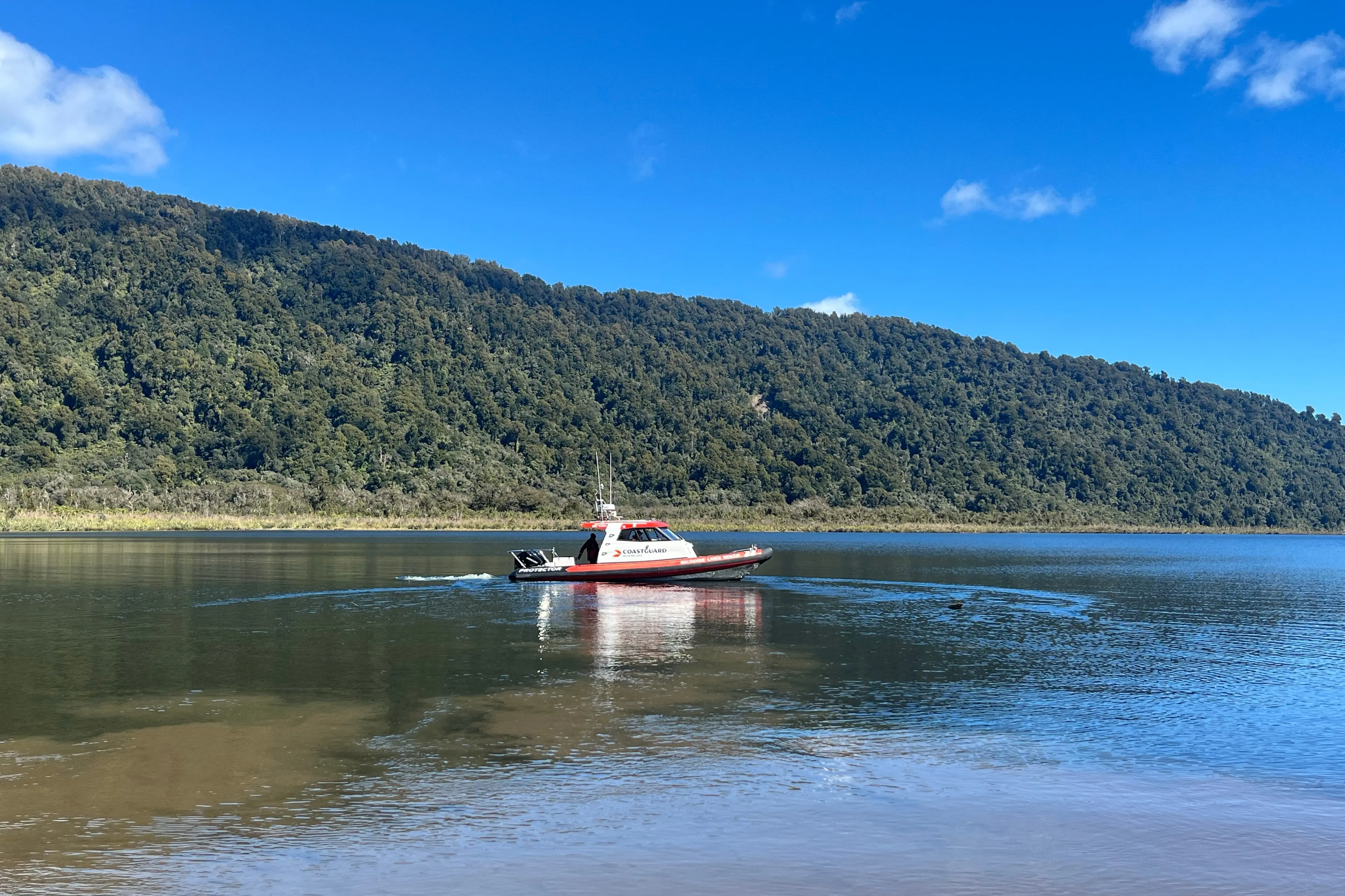 The boat used to scan Lake Moeraki in search for missing aircraft ZK-EBU. Photo: Evie Sinclair