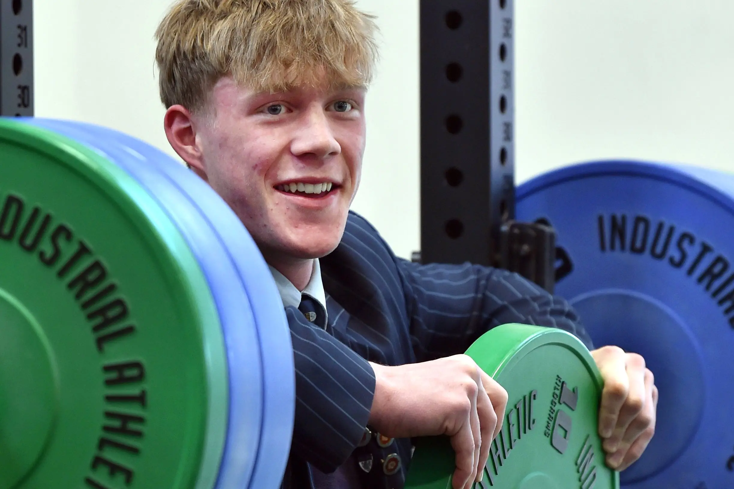 Weightlifter Jeremy Manteiga celebrates winning his fifth consecutive national school\\'s title at King\\'s High School on Thursday. Photo: Peter McIntosh
