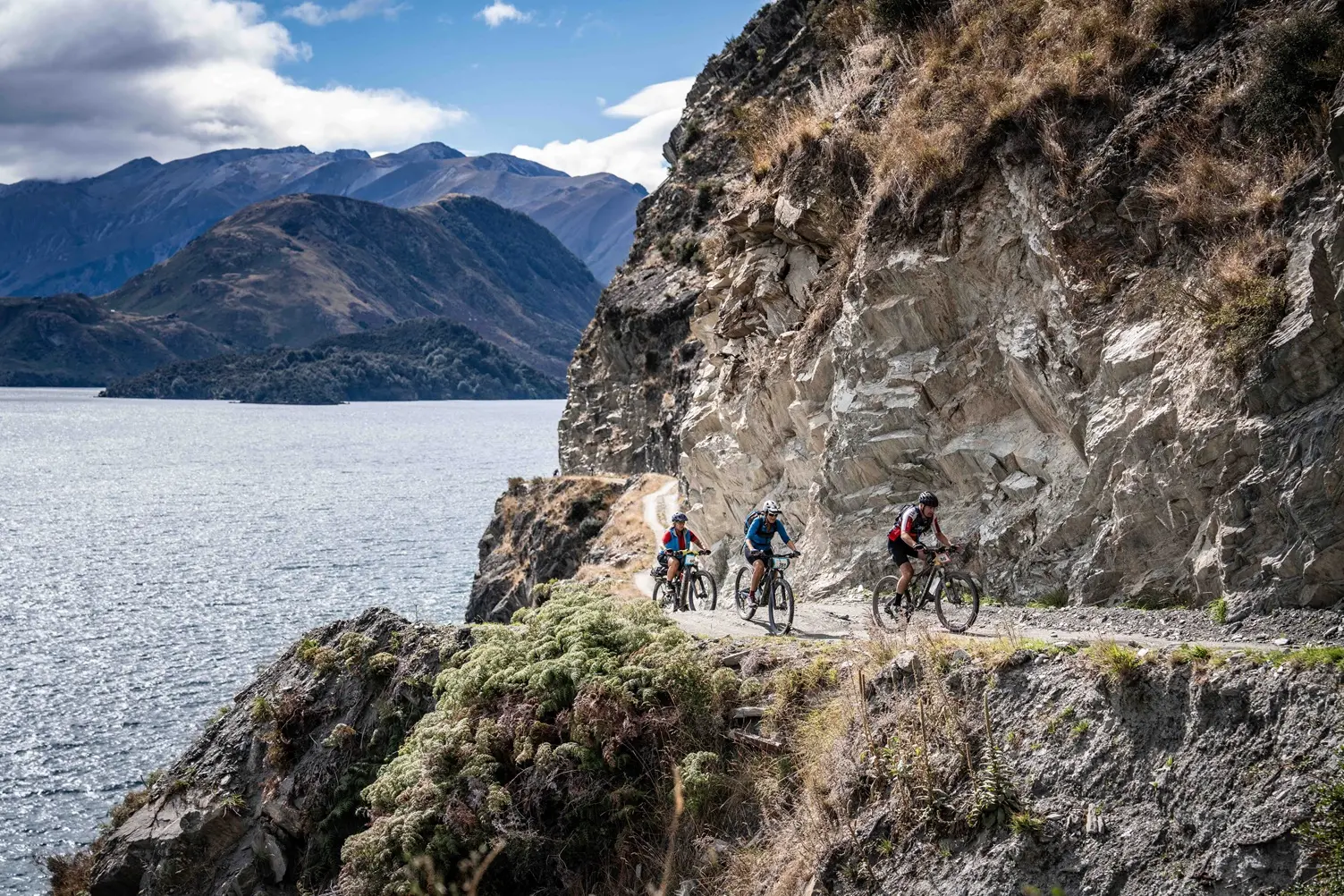 Riders navigate the Dingle Burn bluffs during the 2026 Lake H\\u0101wea Epic. Photo: Diego Belli
