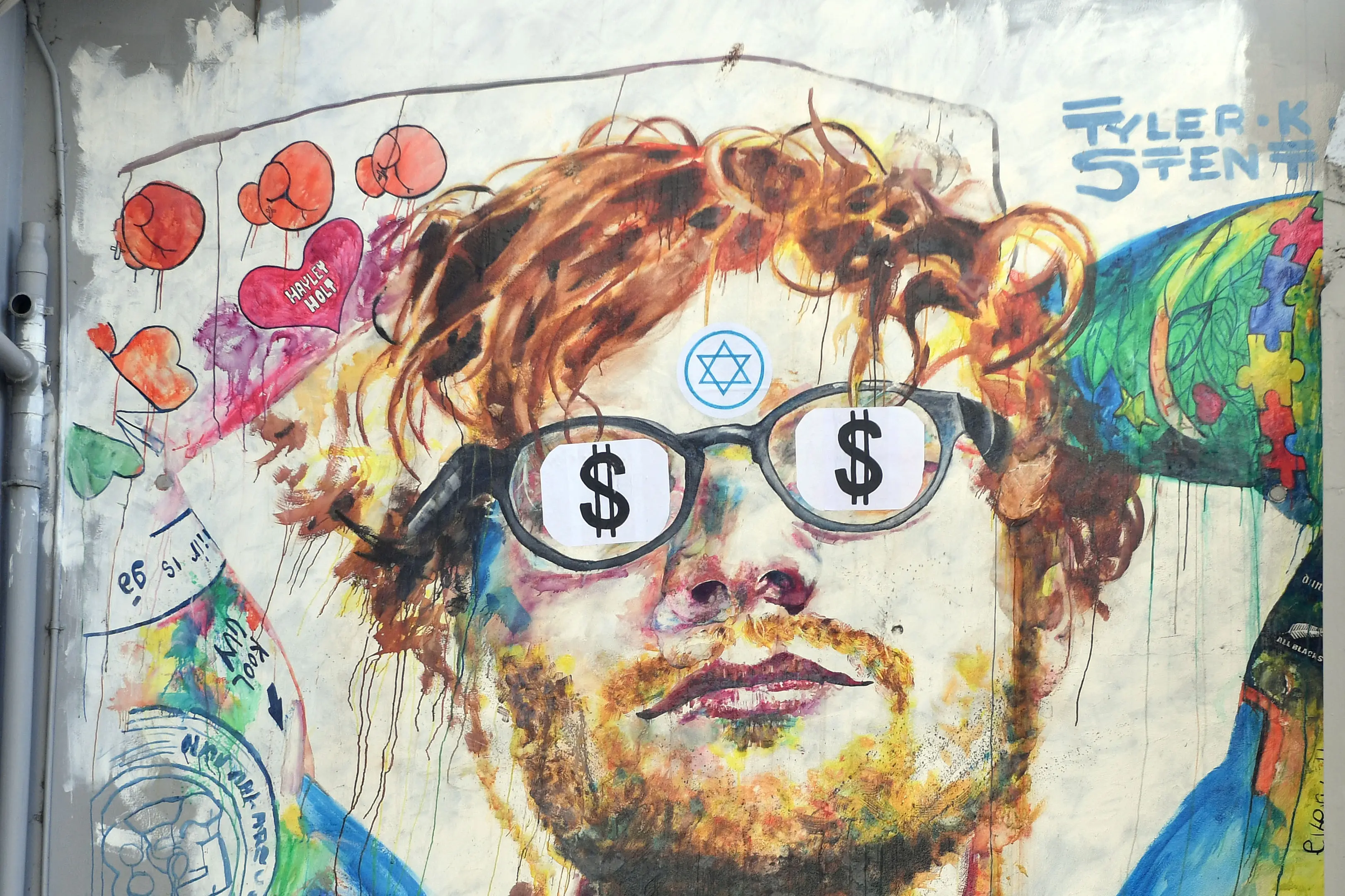 The Ed Sheeran mural in Bath St was defaced with dollar sign stickers and a Star of David of Thursday. Photo: Stephen Jaquiery