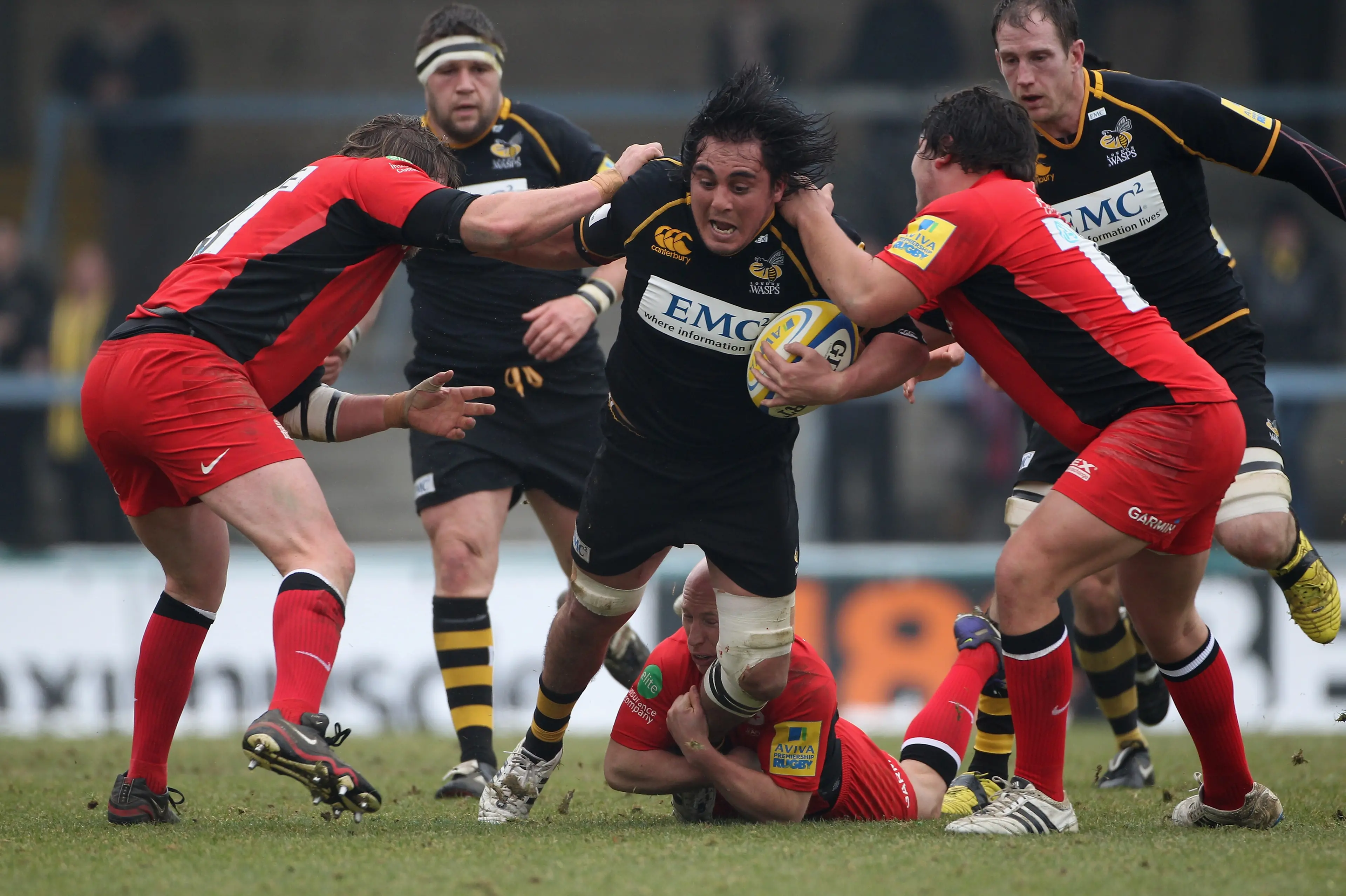 Jonathan Poff busting through tackles for London Wasps against Saracens during an Aviva Premiership match in 2012. Photo: Tom Shaw/Getty Images