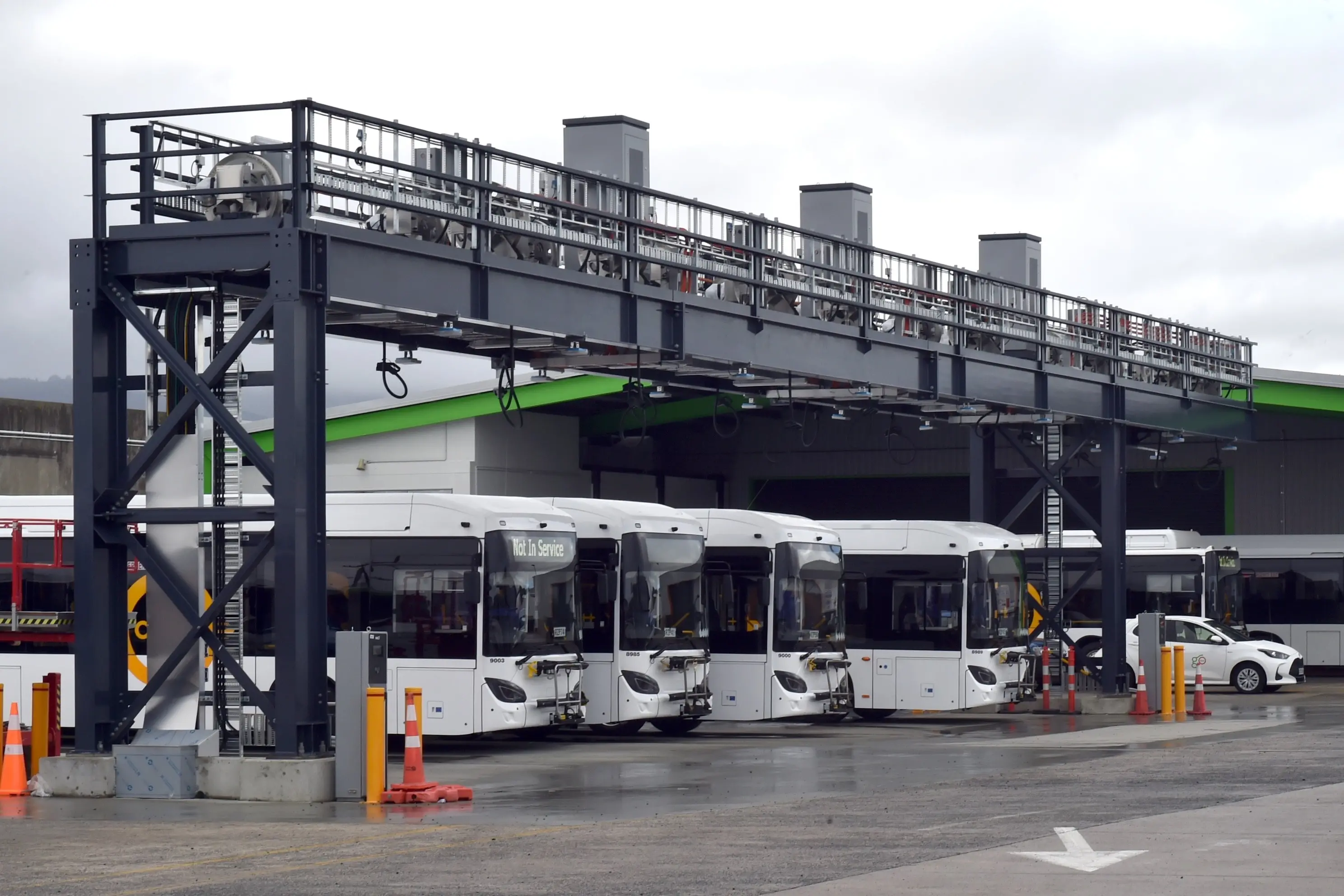 Electric buses recharge under a new charging gantry at Go Bus\\' Portsmouth Dr bus depot, South Dunedin on Friday. Photo: Gregor Richardson