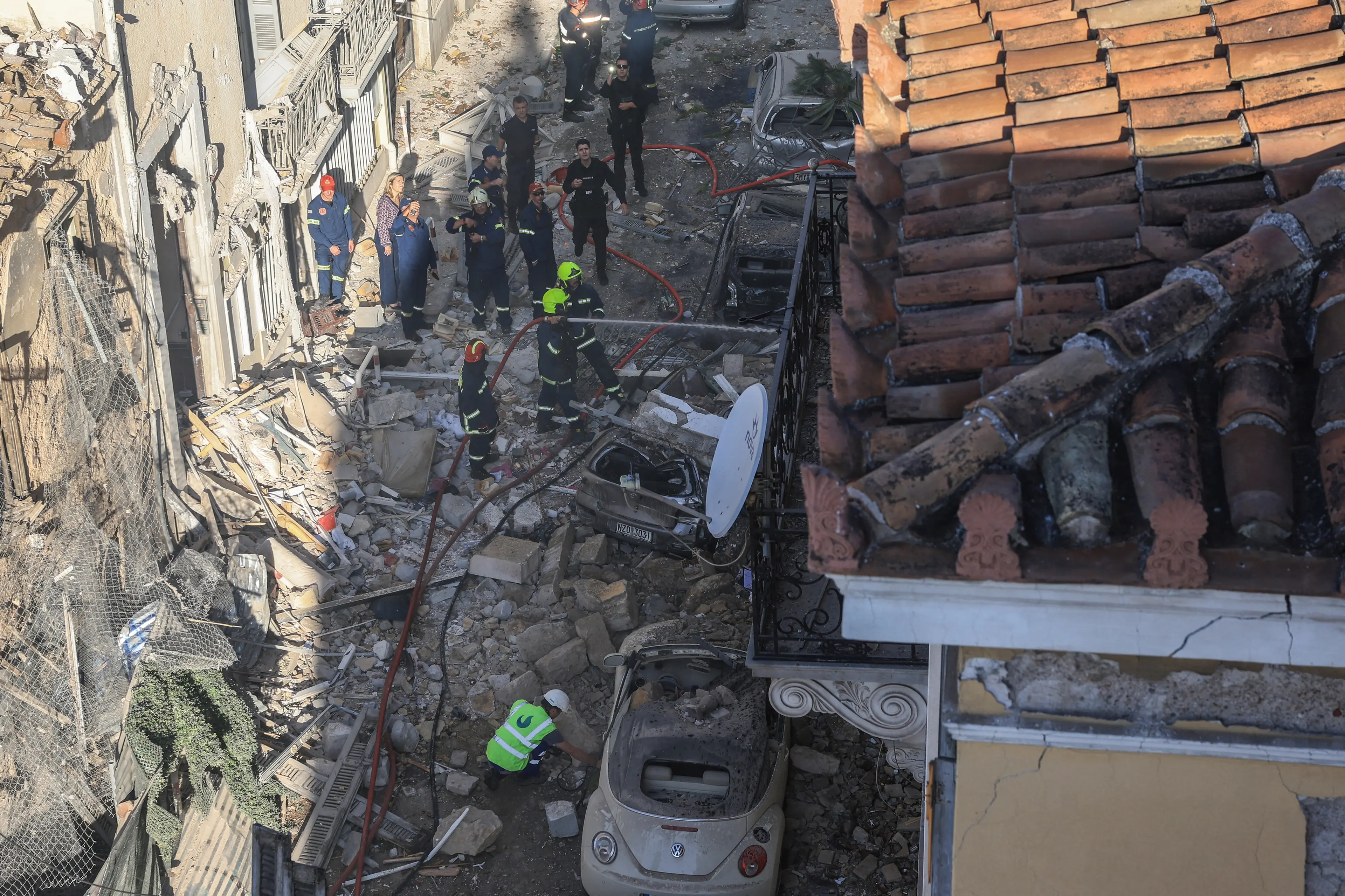 Emergency personnel at the site of the partially collapsed building in central Athens. Photo: Reuters