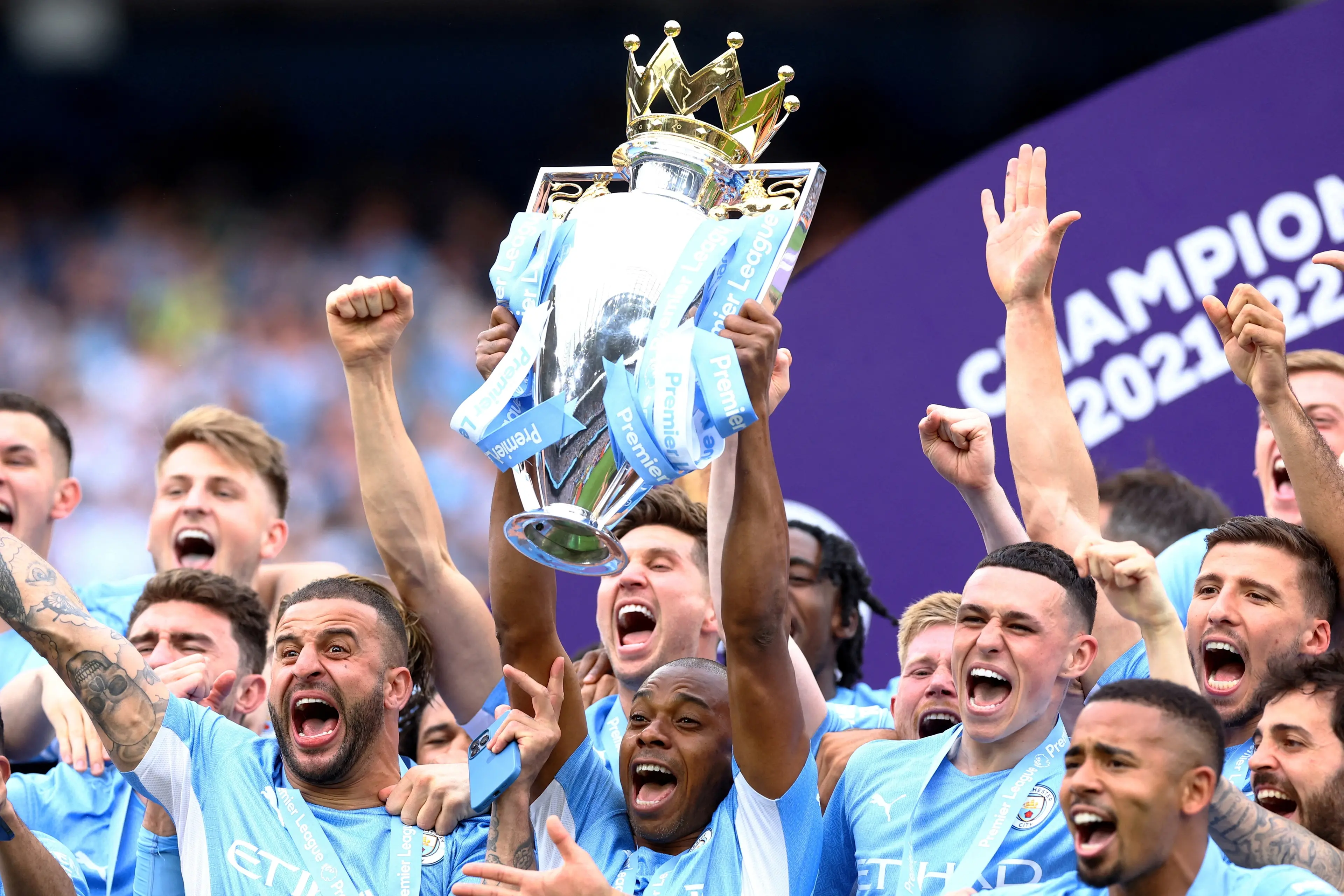 Manchester City\\'s Fernandinho lifts the trophy as he celebrates with teammates after winning the Premier League in this 2022 file photo. Photo: Reuters