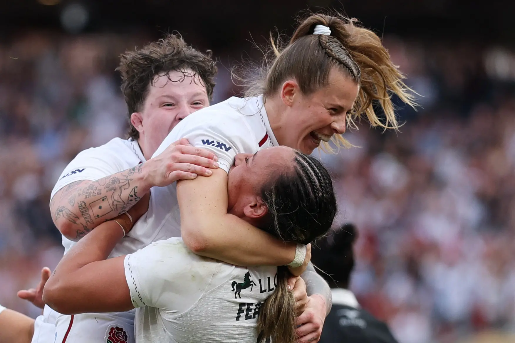 England\\'s Zoe Harrison celebrates with teammates after scoring the match-winning try. Photo: Reuters