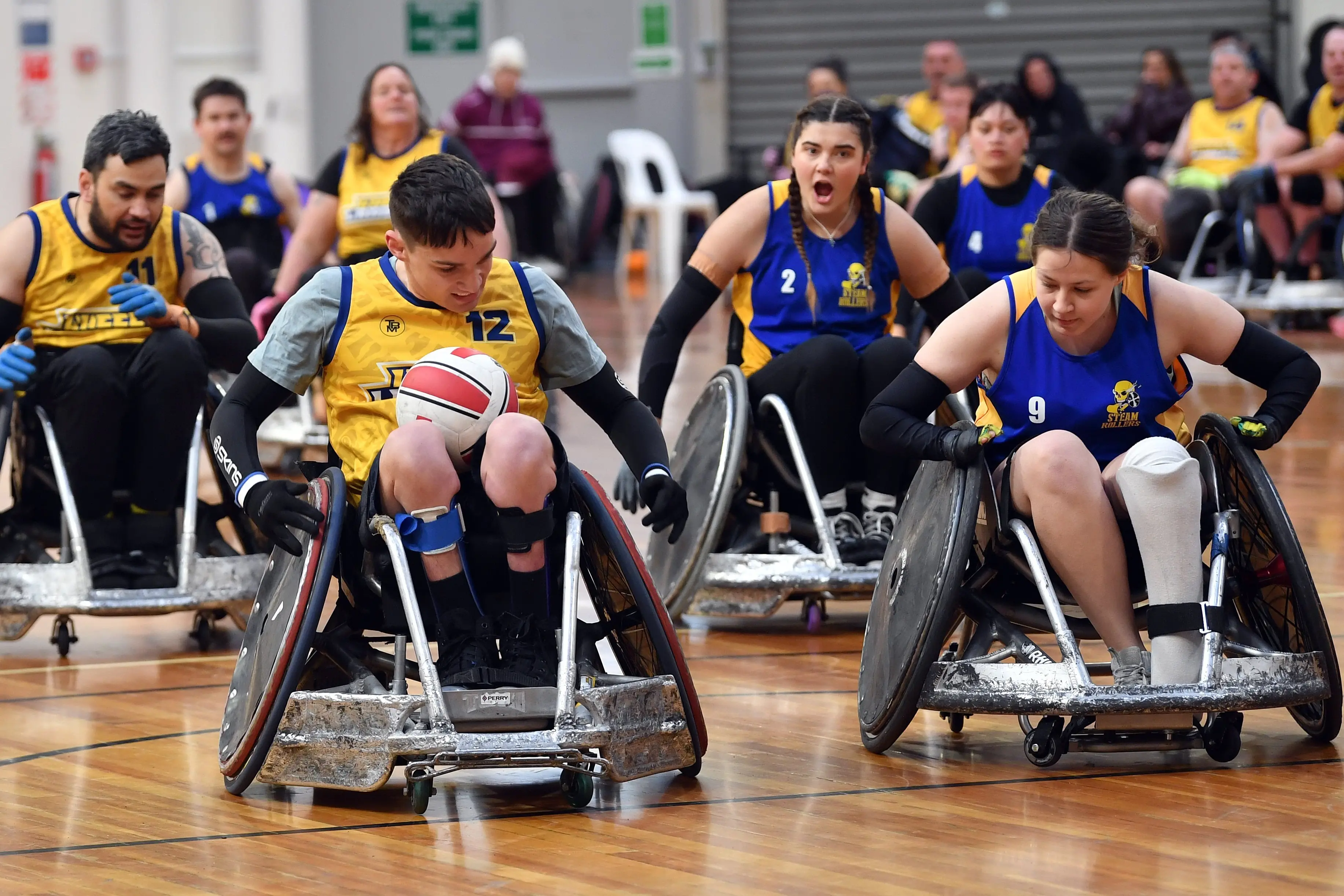 Otago attacker Matt Russell (No 12) tries to streak away from Bay of Plenty defender Rhiannon Bellete.