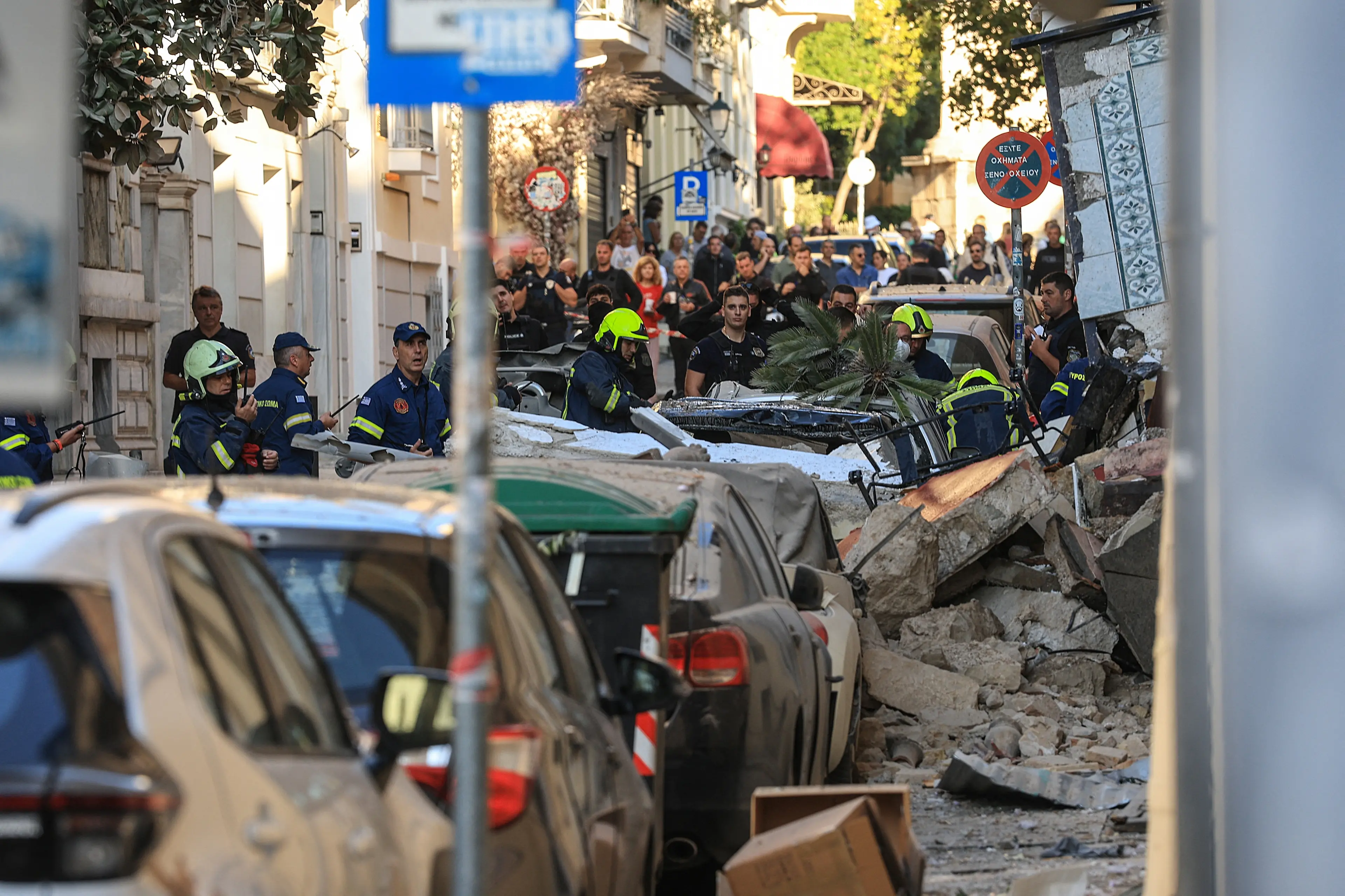Emergency personnel work at the site of the building collapse in central Athens. Photo: Reuters
